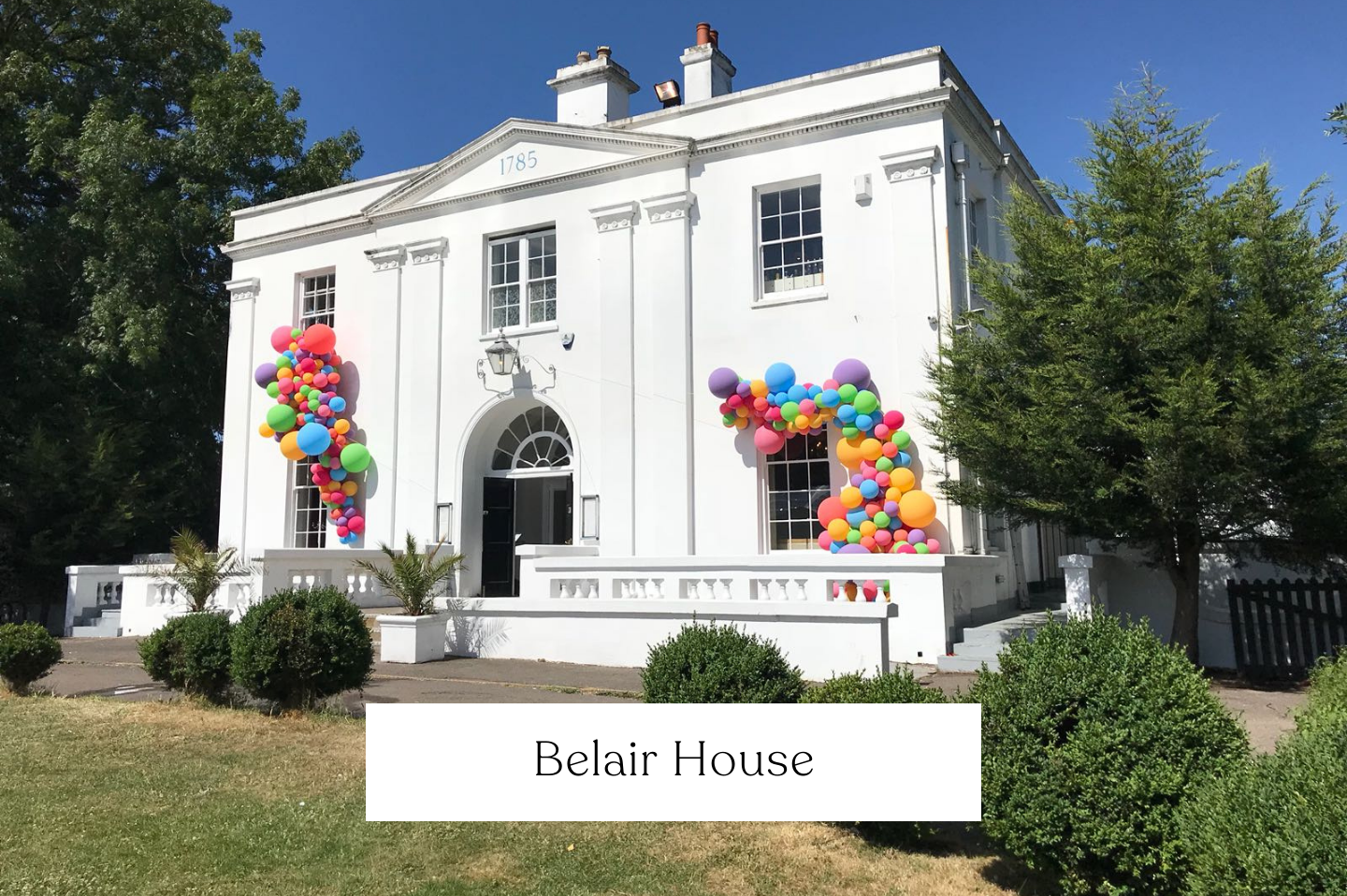 Colourful balloons for Belair House. Window Spill External Balloon Garlands. 