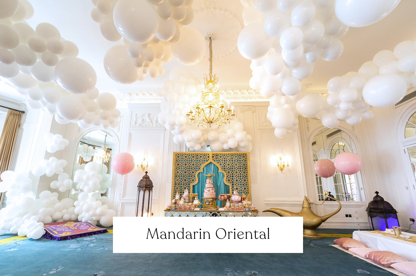 Elegant room in Mandarin Oriental Hotel, London, decorated with white clouds cluster balloons floating / hanging from the ceiling, some baby pink balloons. 