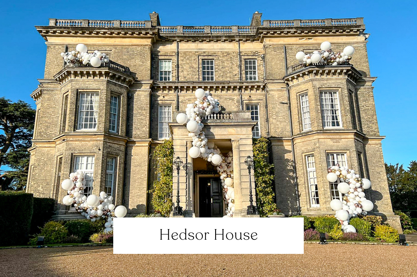 Hedsor House, Buckinghamshire. Decorated with balloons garlands from the window spill. External balloons and decor perfect for weddings & private parties. 