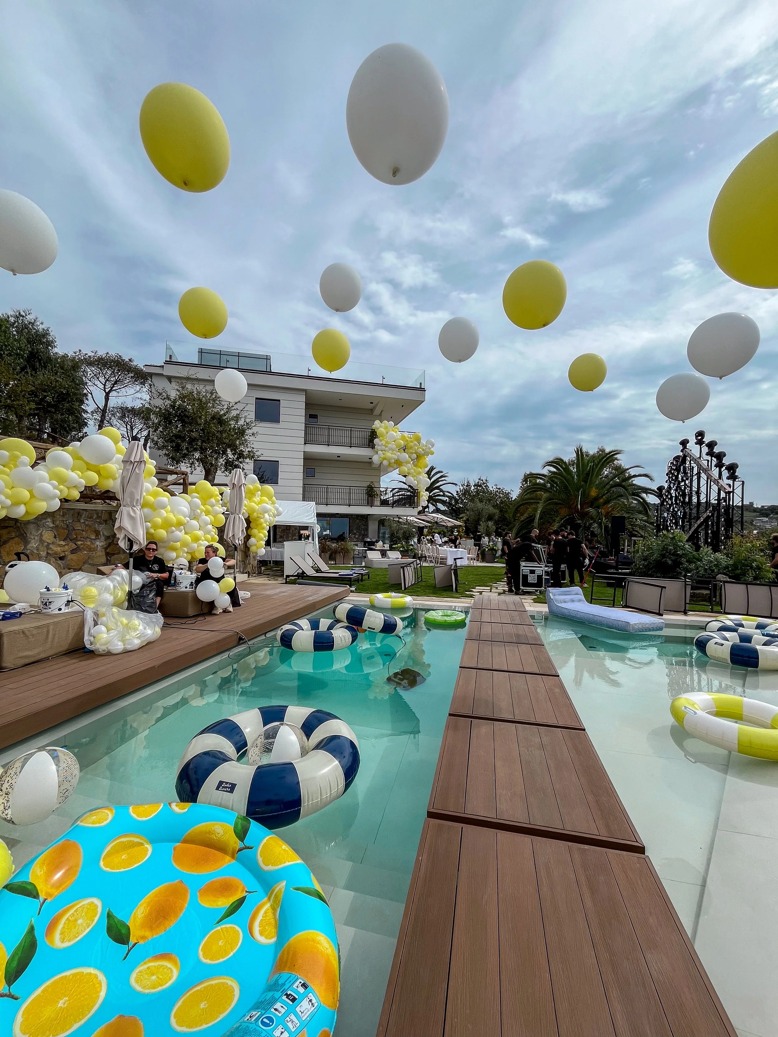Italy Wedding After Party - Lemon yellow pool suspended