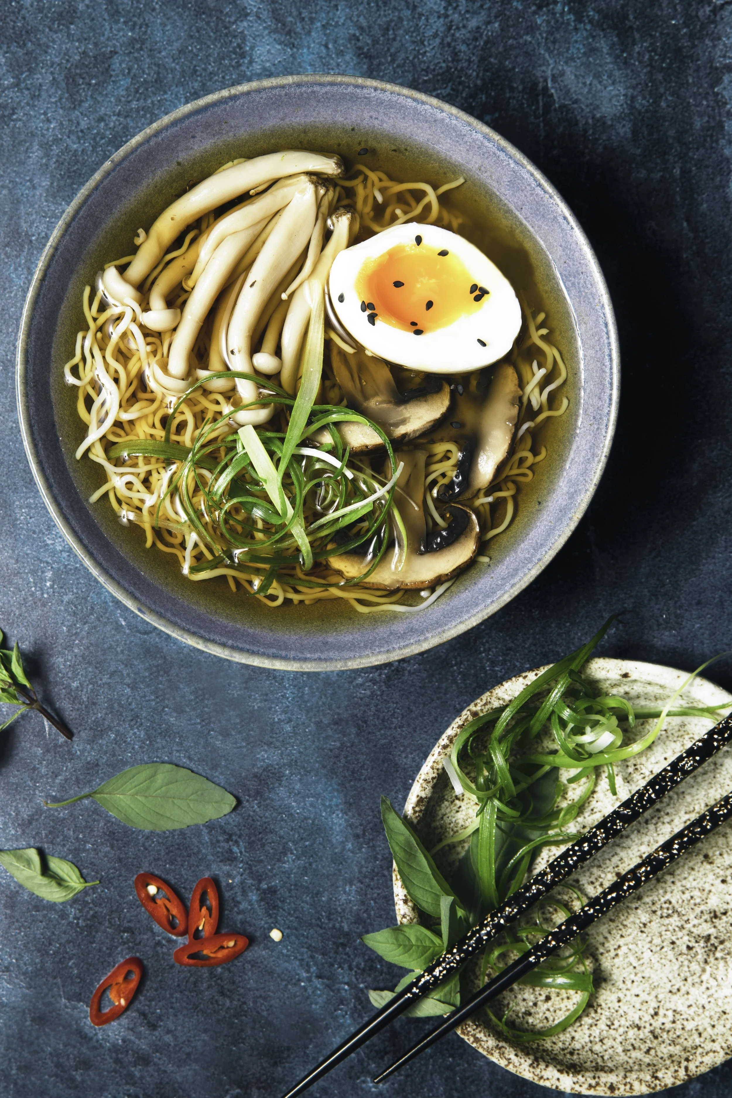 this image features ramen soup, chilli, noodles, mushrooms,food, vegetarian