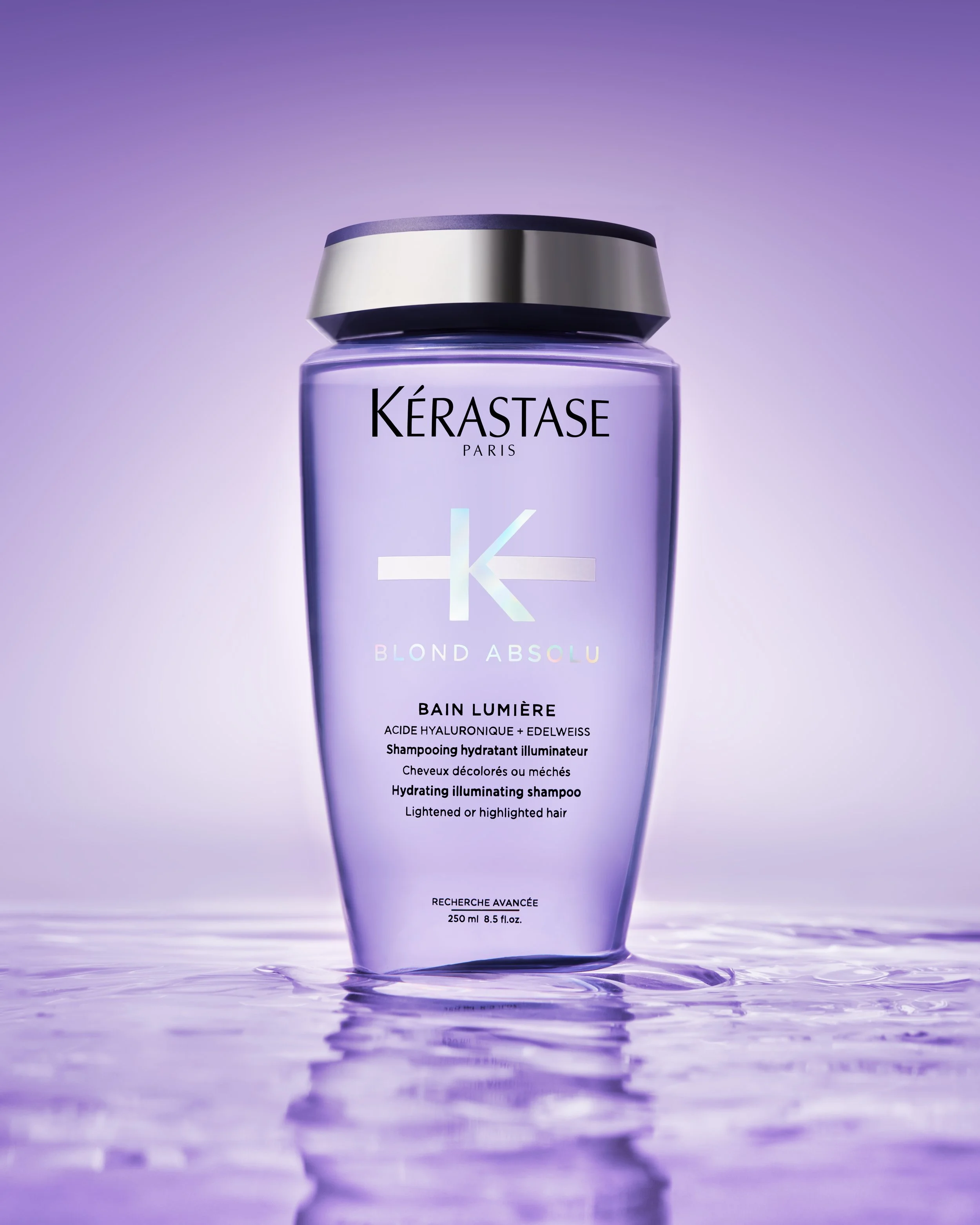 Lizzy Clough is a Commercial Photographer & Retoucher specialising in products, beauty, fragrance, food and drink. This image features Kerastase blonde shampoo in water, purple gradient