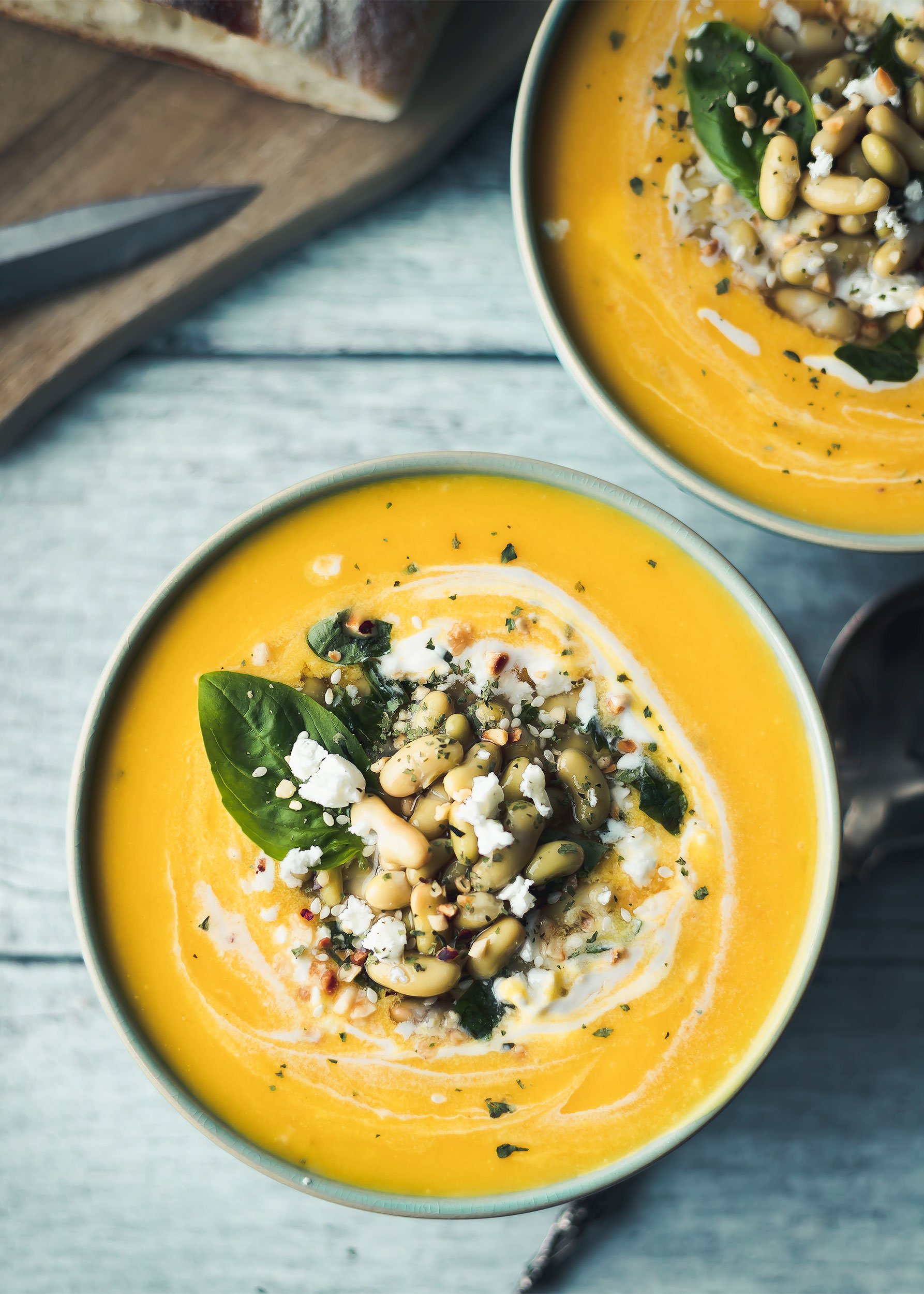 this image features butternut squash soup, food, vegetarian