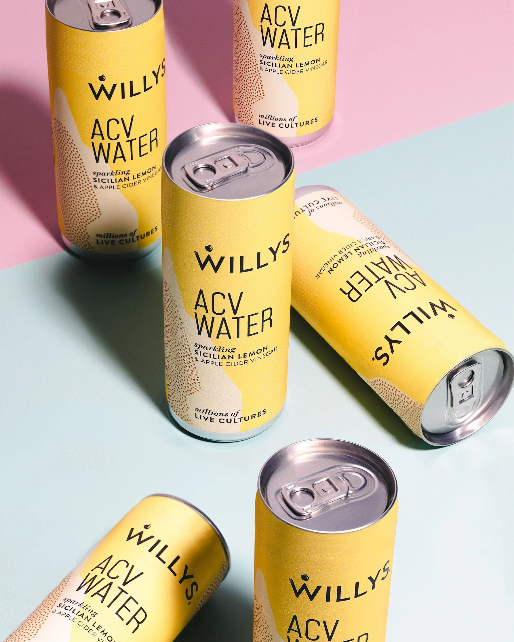 This image features ACV water, group photo, cans of drink