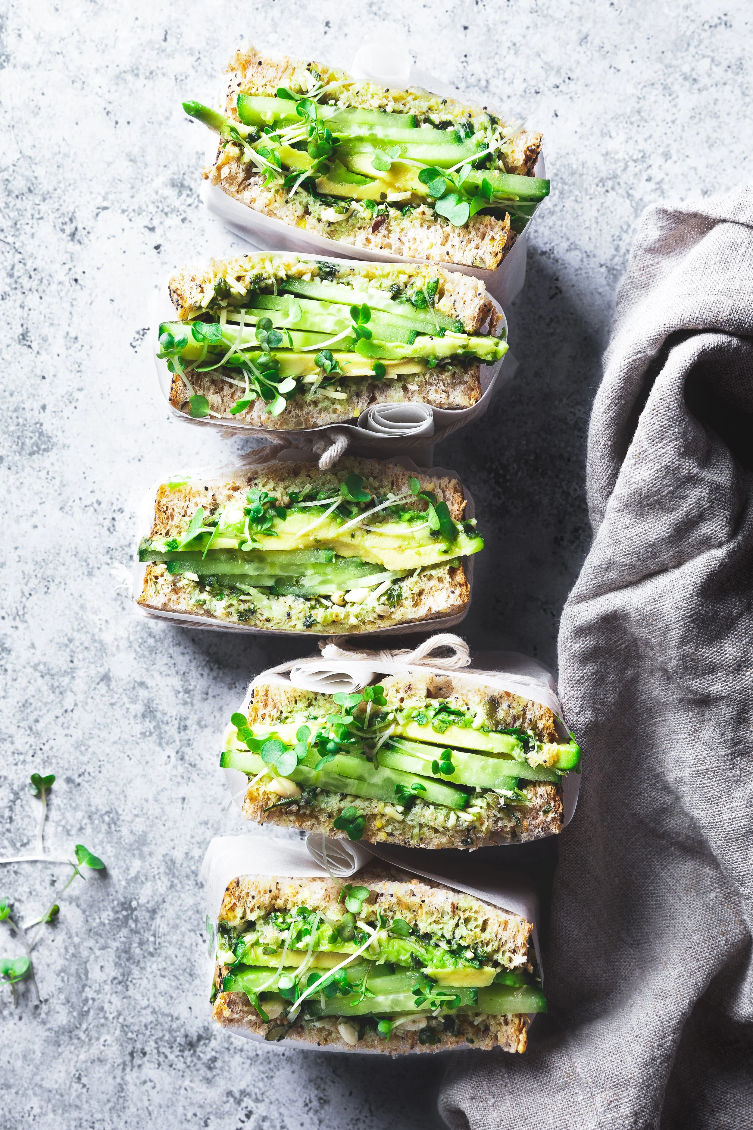 this image features avocado, sandwich,food, vegetarian