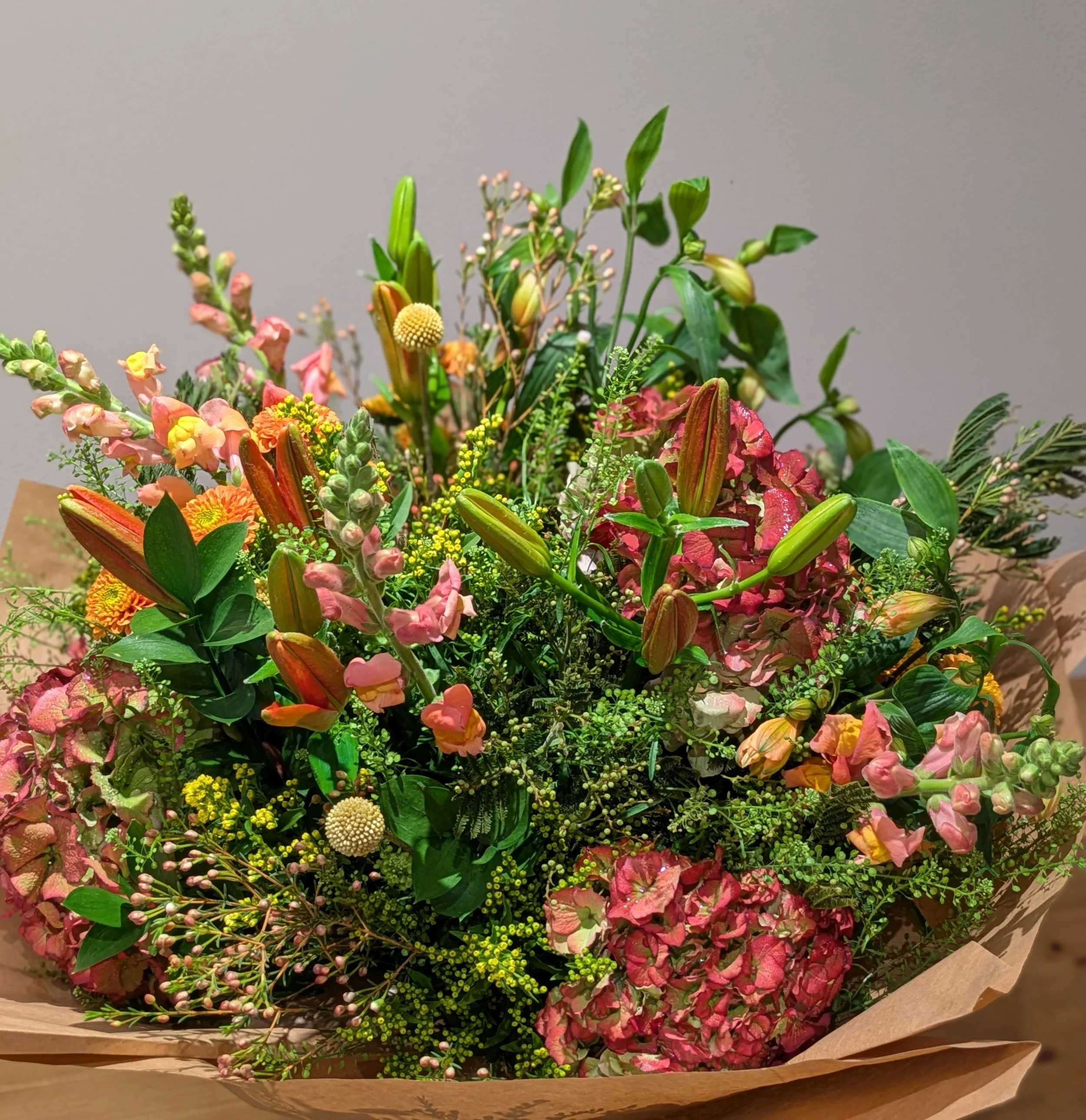 A Bright and Cheerful Birthday Bouquet
Bursting with colour and joy, this premium silk arrangement is designed to make any birthday feel truly special. Featuring vibrant red lilies, elegant snapdragons that add height and movement, and multiple luxur