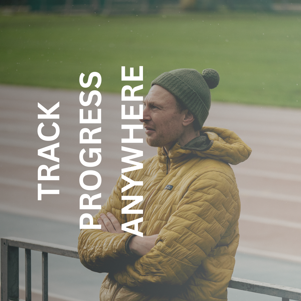 Greig standing on a running track offering run coach services in Glasgow