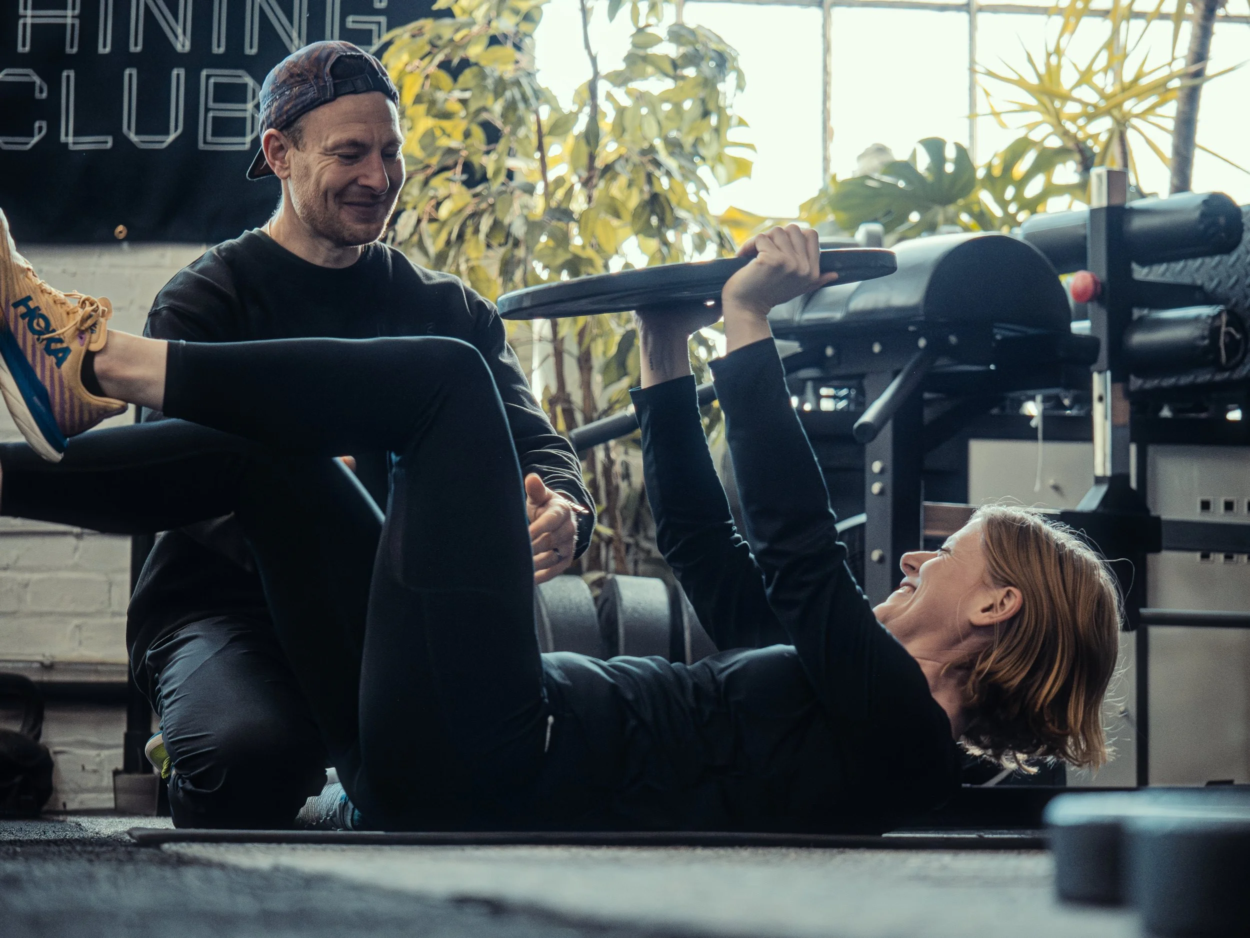 Greig working with a client in his gym offering strength and conditioning personal training in Glasgow