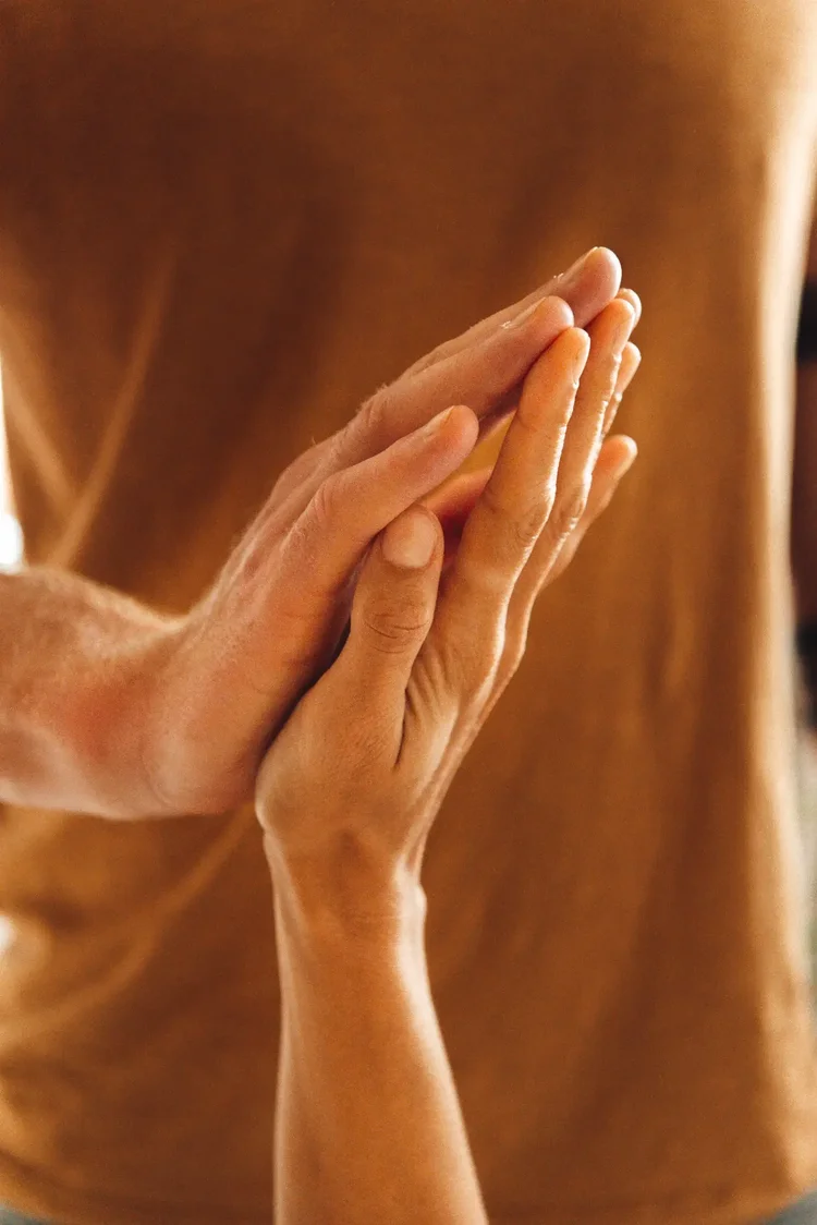 Hands meeting during somatic bodywork in Berlin Friedrichshain