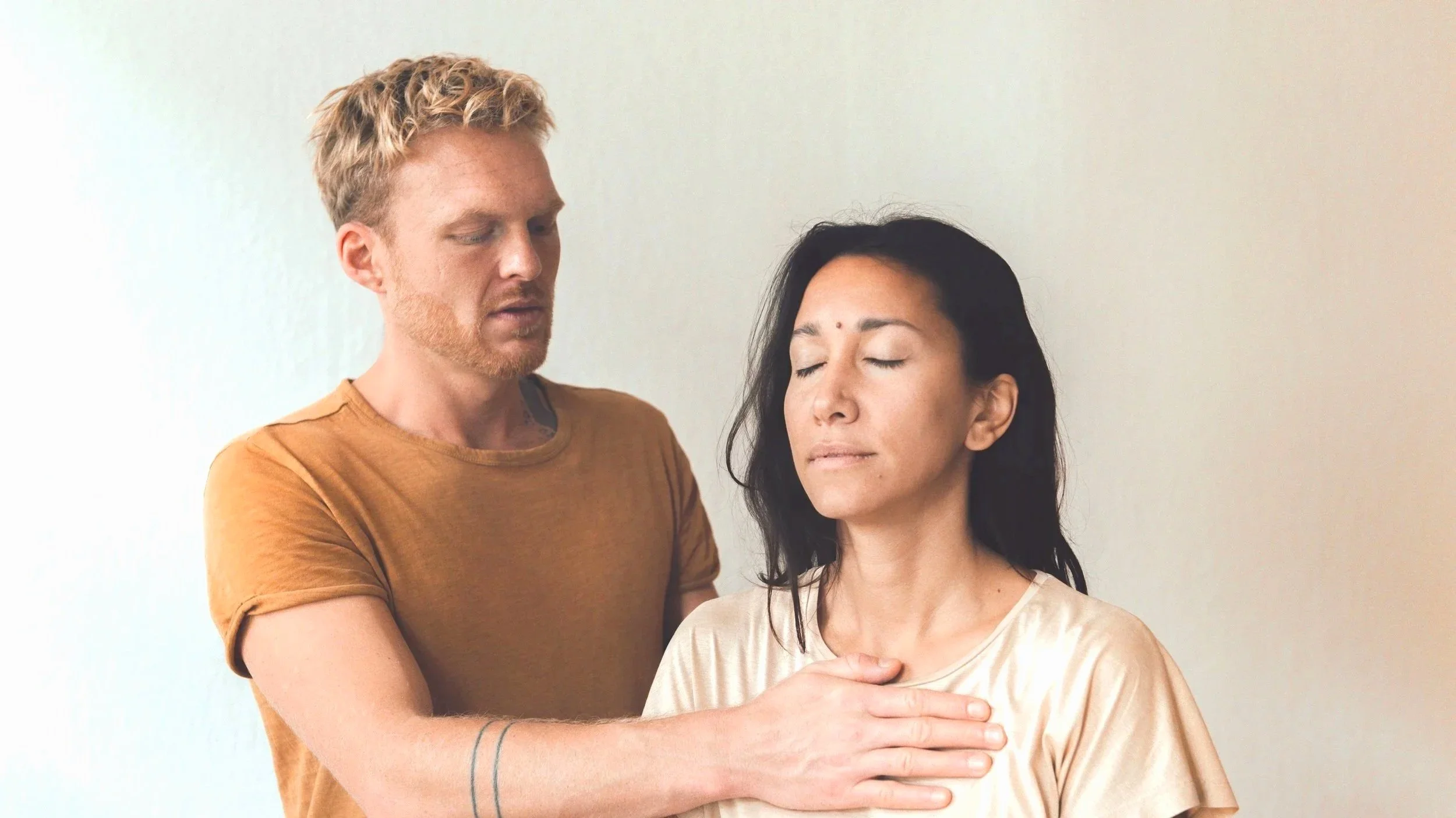 Somatic therapy session with embodied touch and awareness