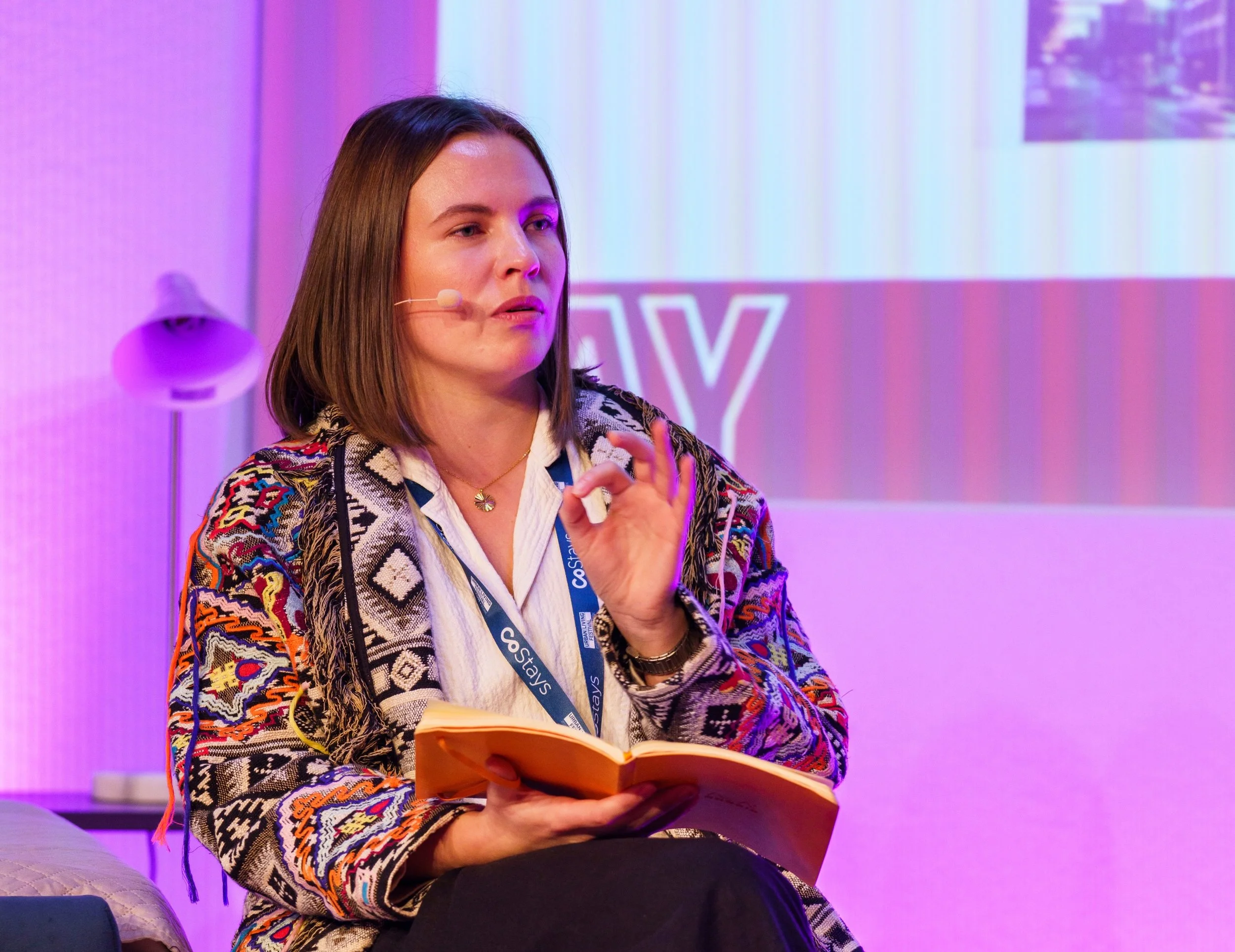 Eloise Hanson moderating a panel discussion at Urban Living Festival. 