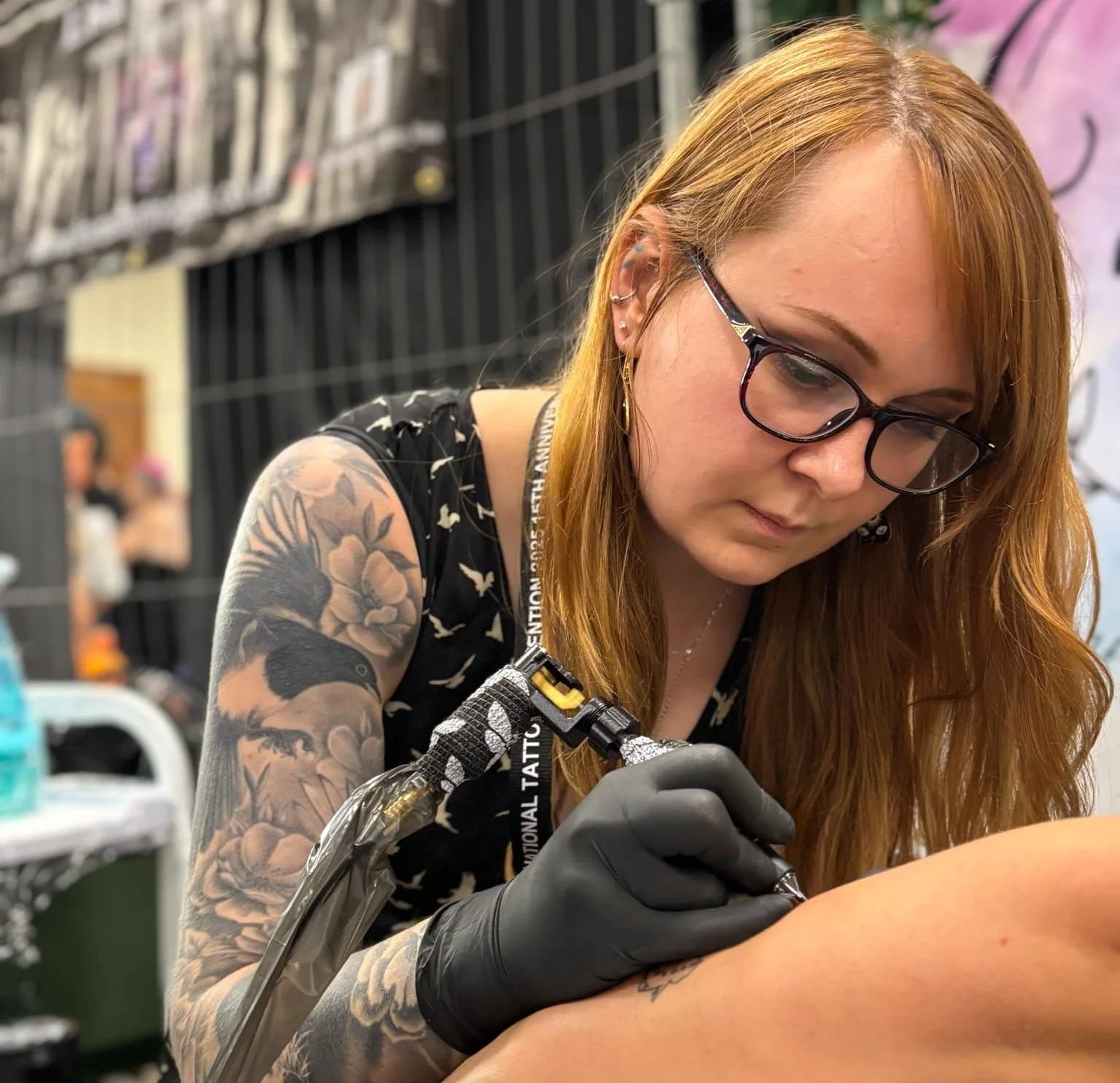 A colour image of Vick Carpenter mid tattoo
