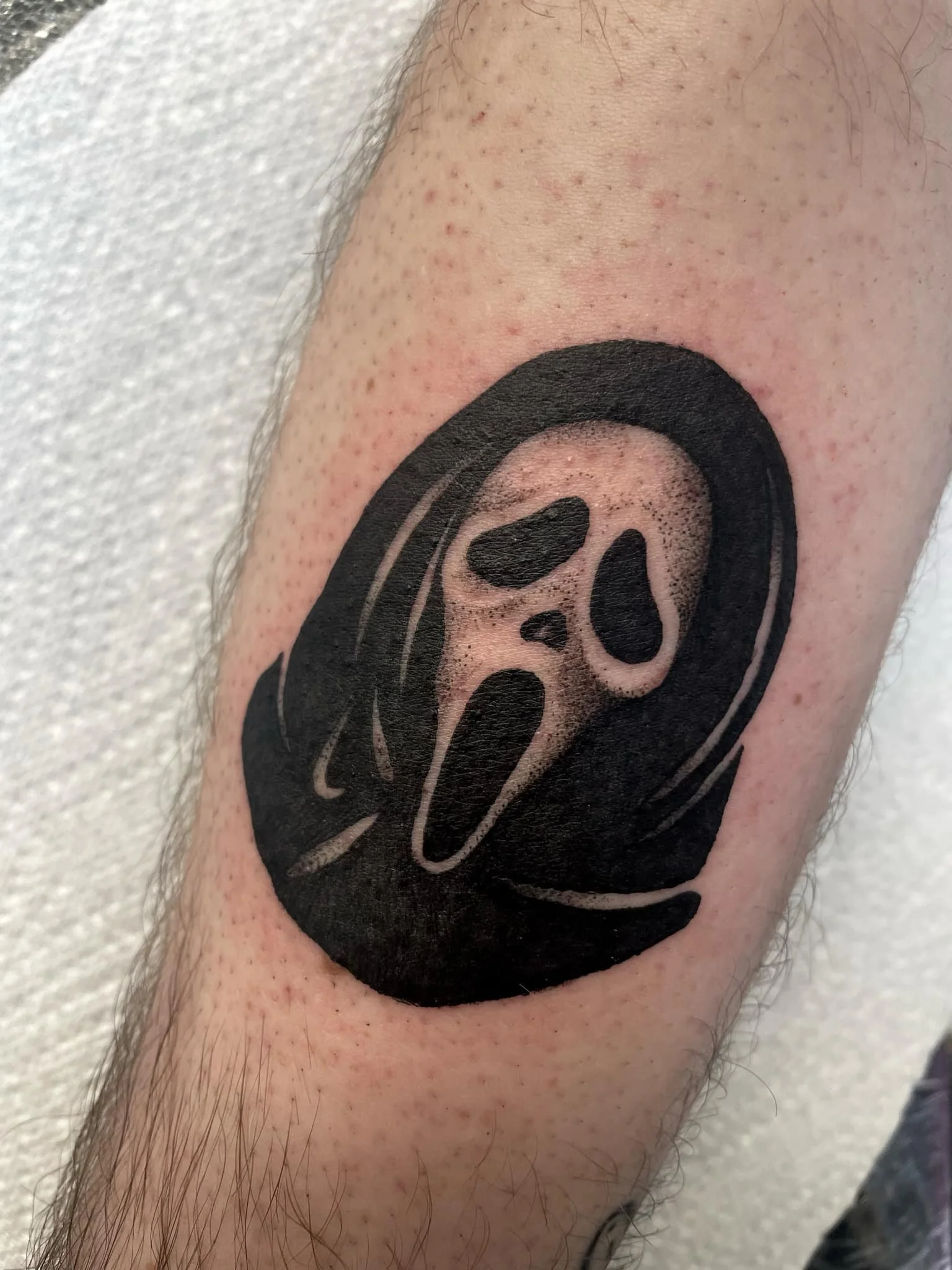 A dot work Scream Ghostface tattoo
