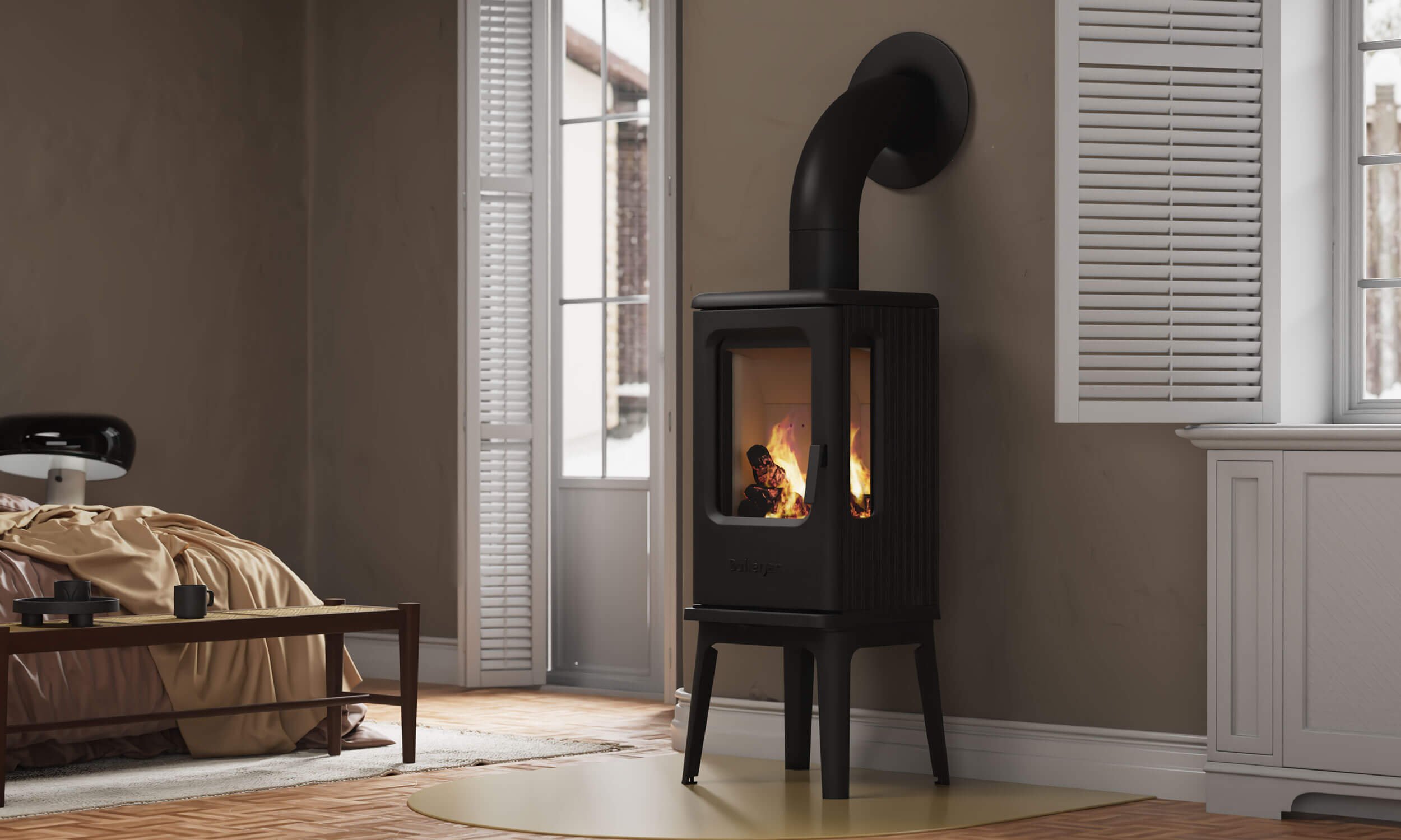 Der Kaminofen Bullerjan pure mit großer Sichtscheibe und elegantem Design aus Gusseisen, ausgestellt in der Kaminwelt Hennef.