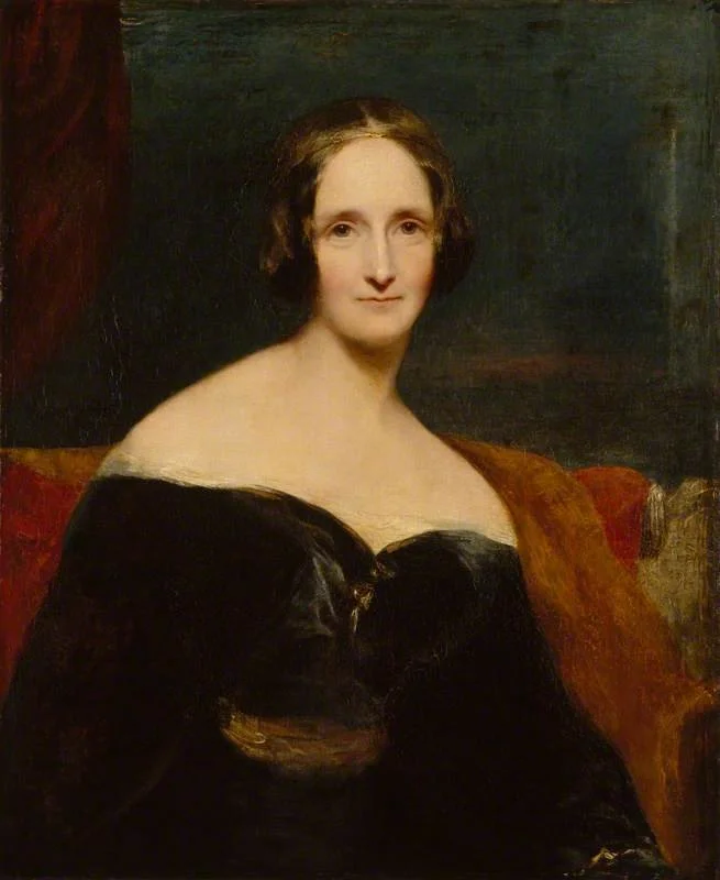 A classical portrait painting of a woman with short brown hair, wearing a black dress with an off-the-shoulder neckline, seated on a red and brown armchair with a dark background.