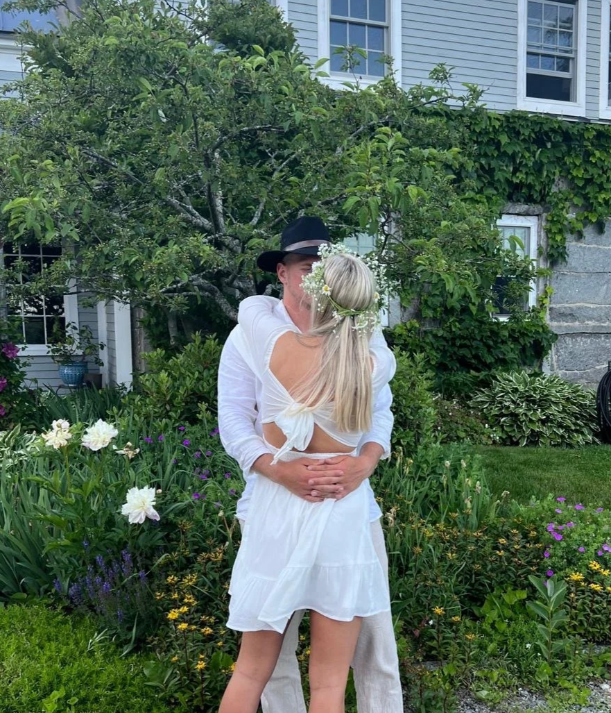 The bride and groom hugging at their wedding planned by Anne.