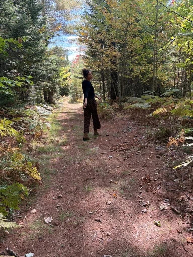 Anne walking in the woods.