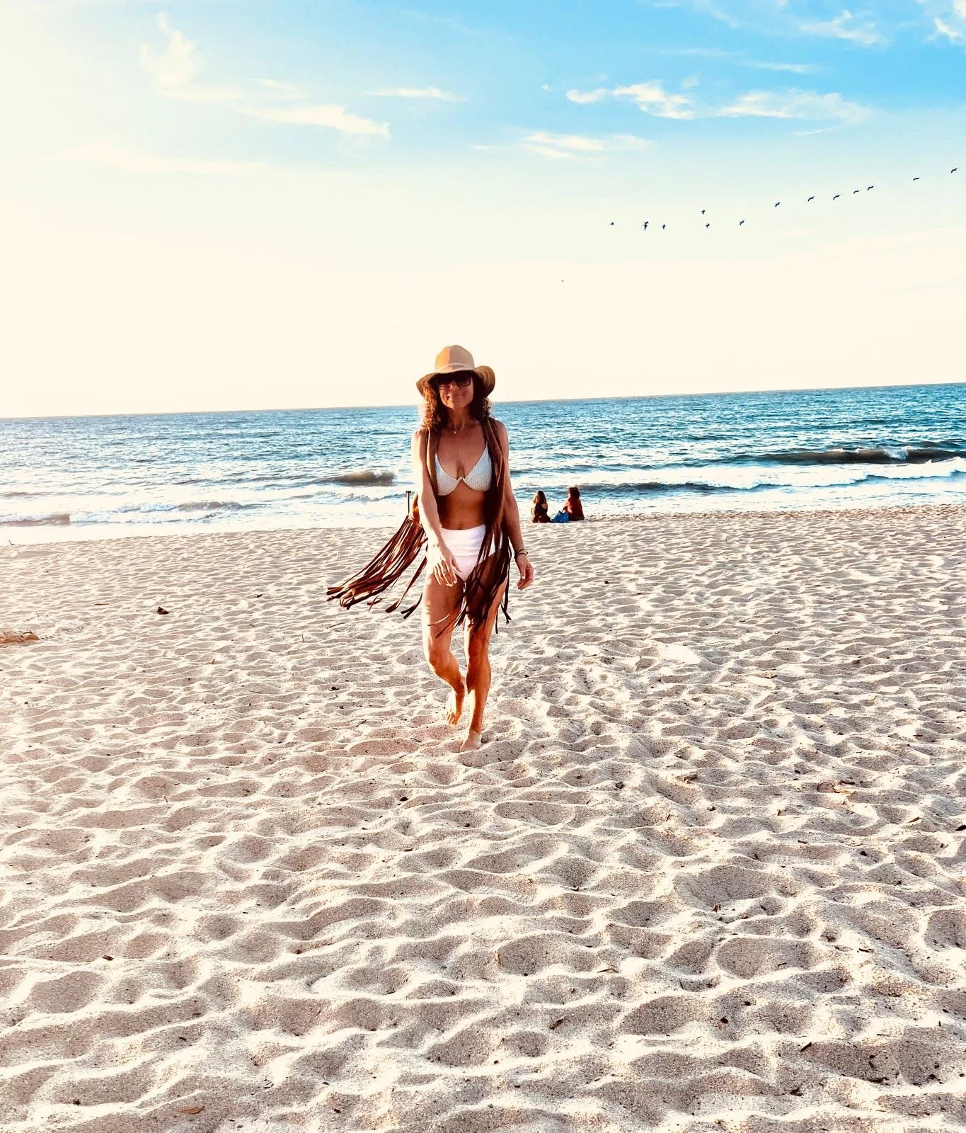 Anne on the beach at an event she planned in Mexico.