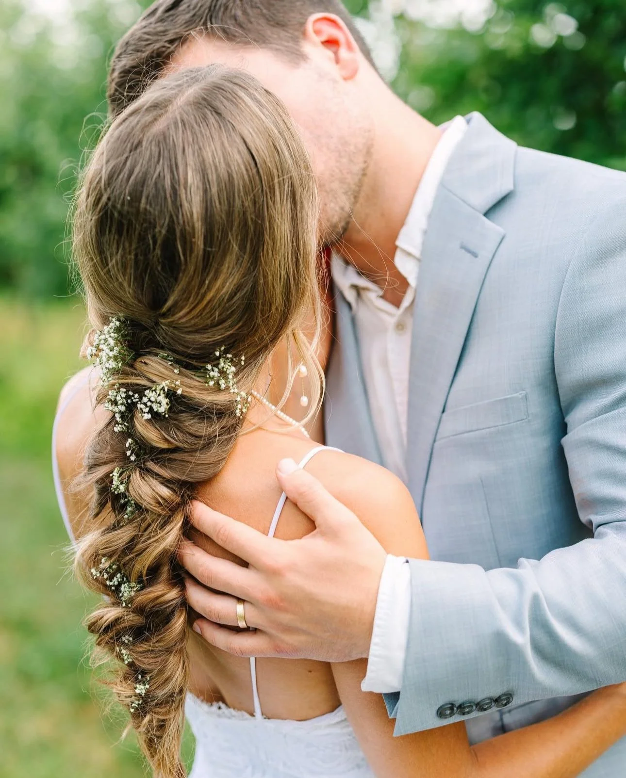 The bride and groom sharing a spacial moment at their outdoor wedding planned by Anne.