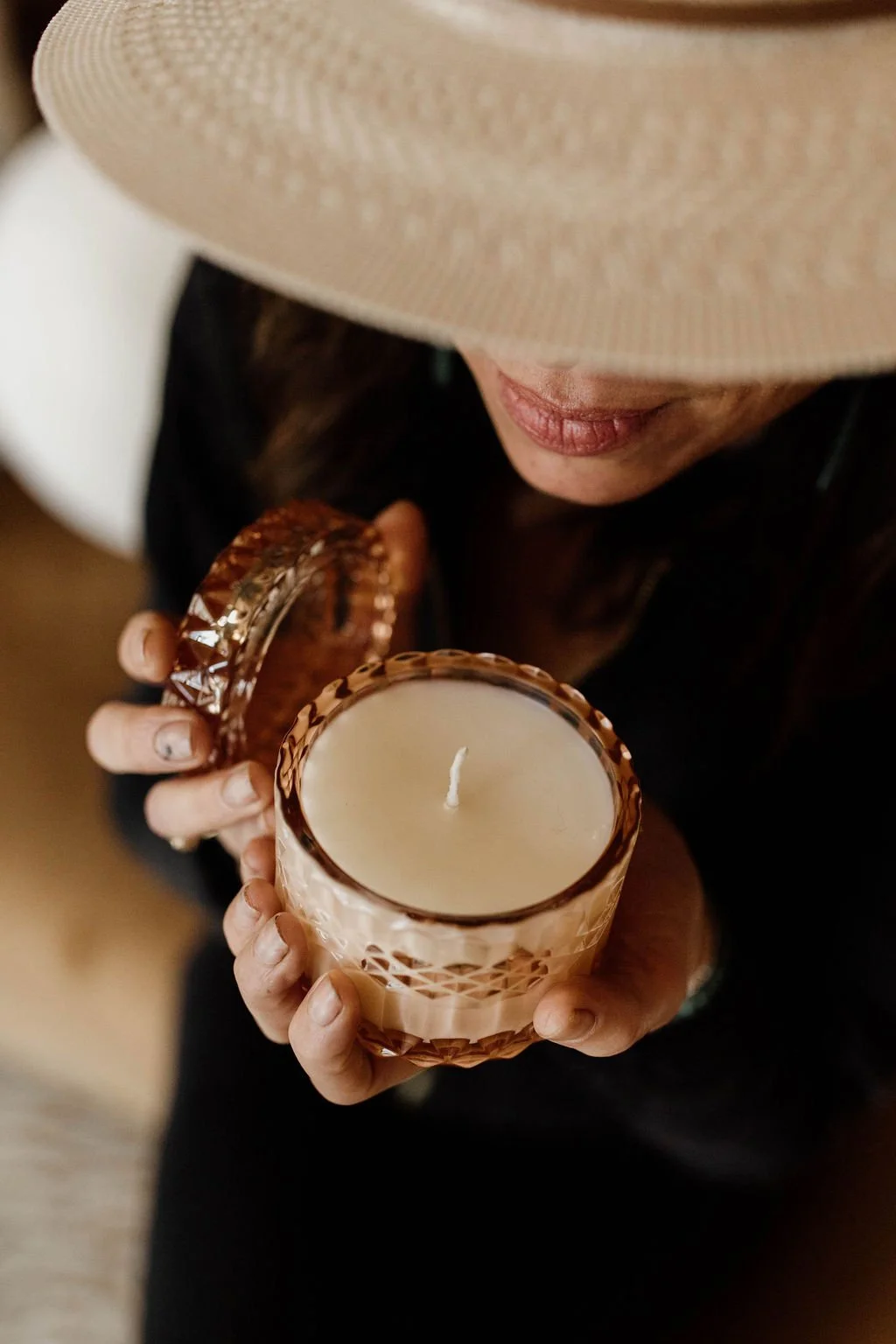 Anne smelling an Opal & Fawn candle.