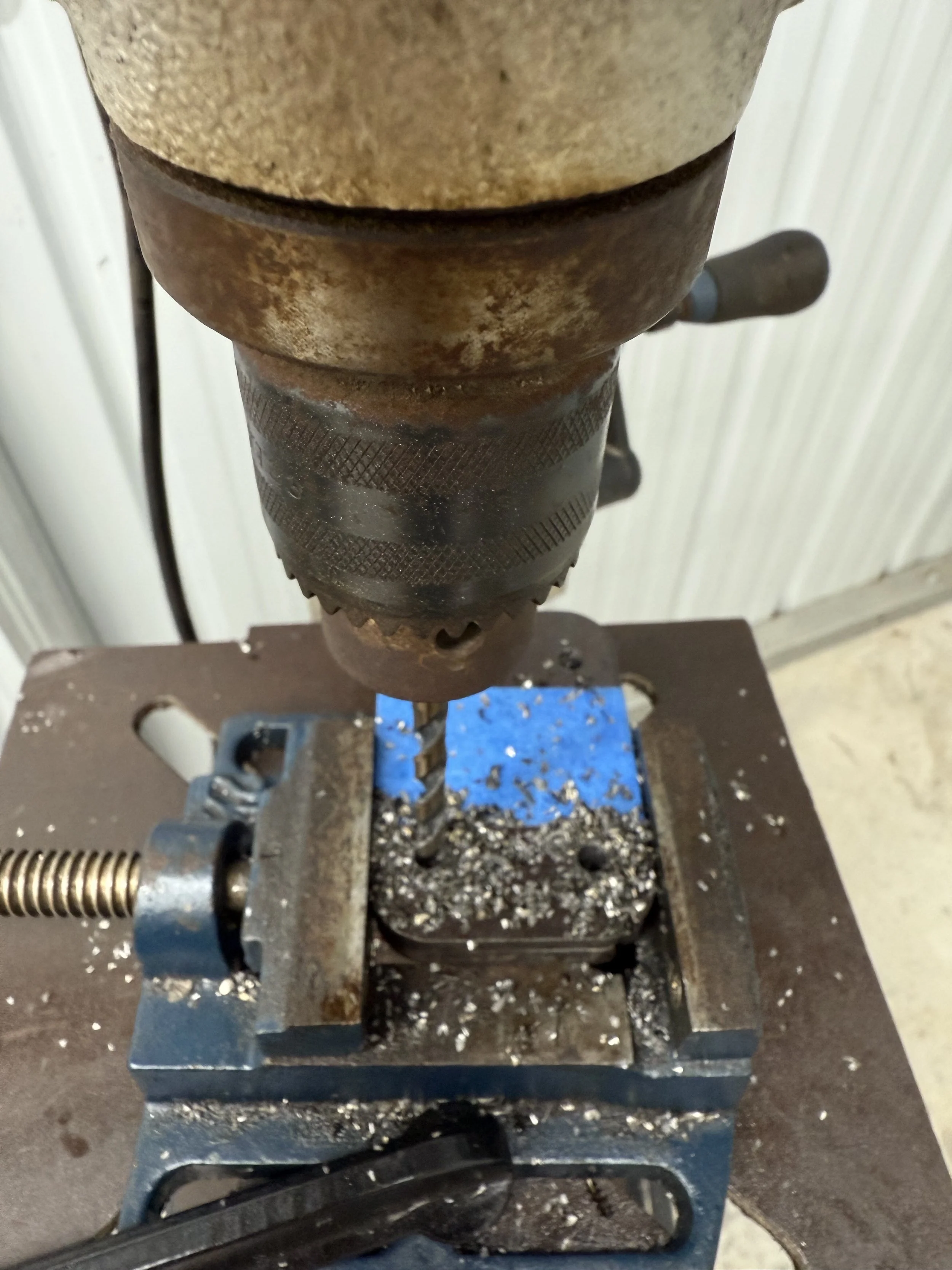 Closeup of drilling bolt holes for casters