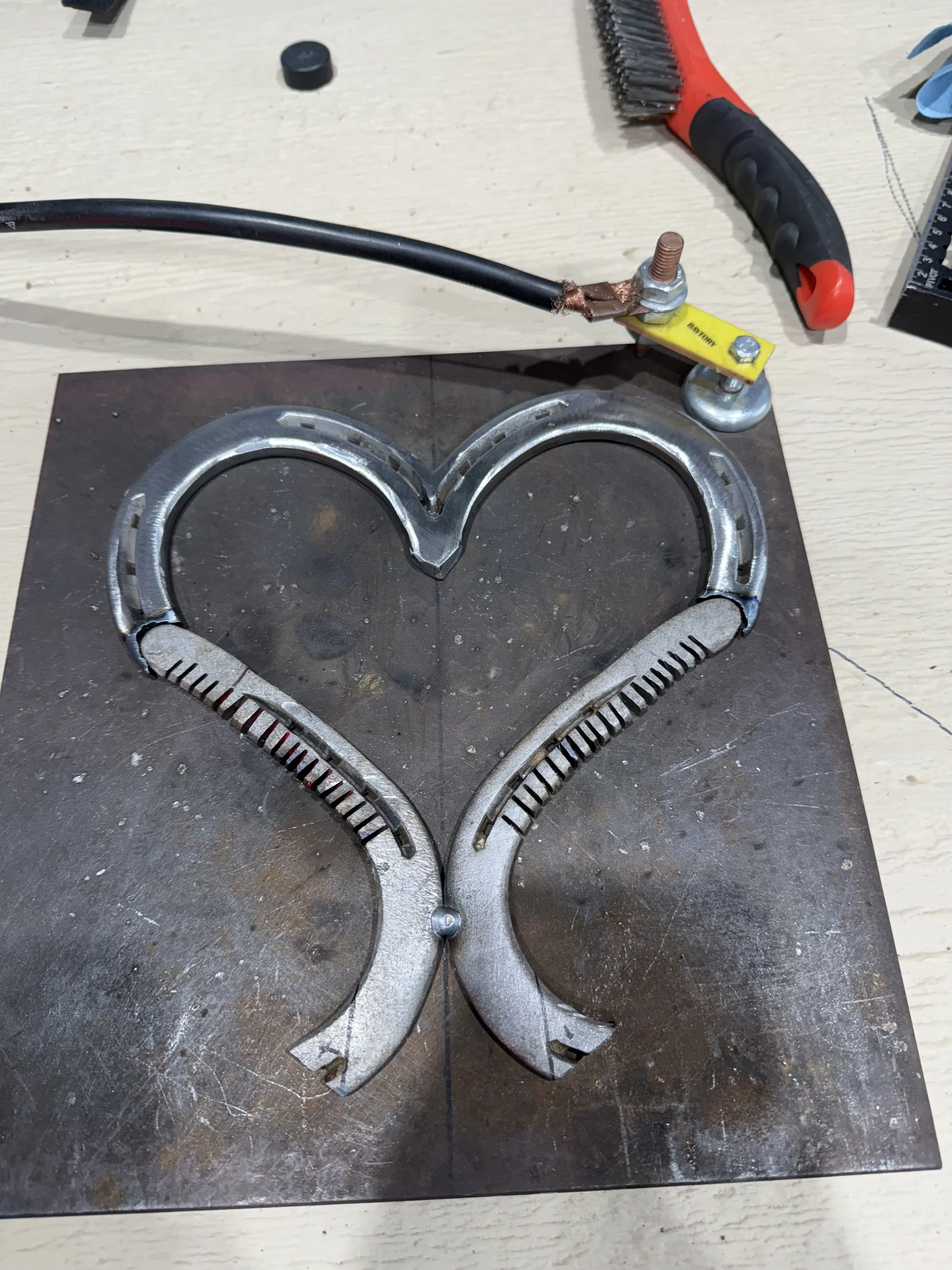 Bending the metal for the bottom half of horseshoe heart