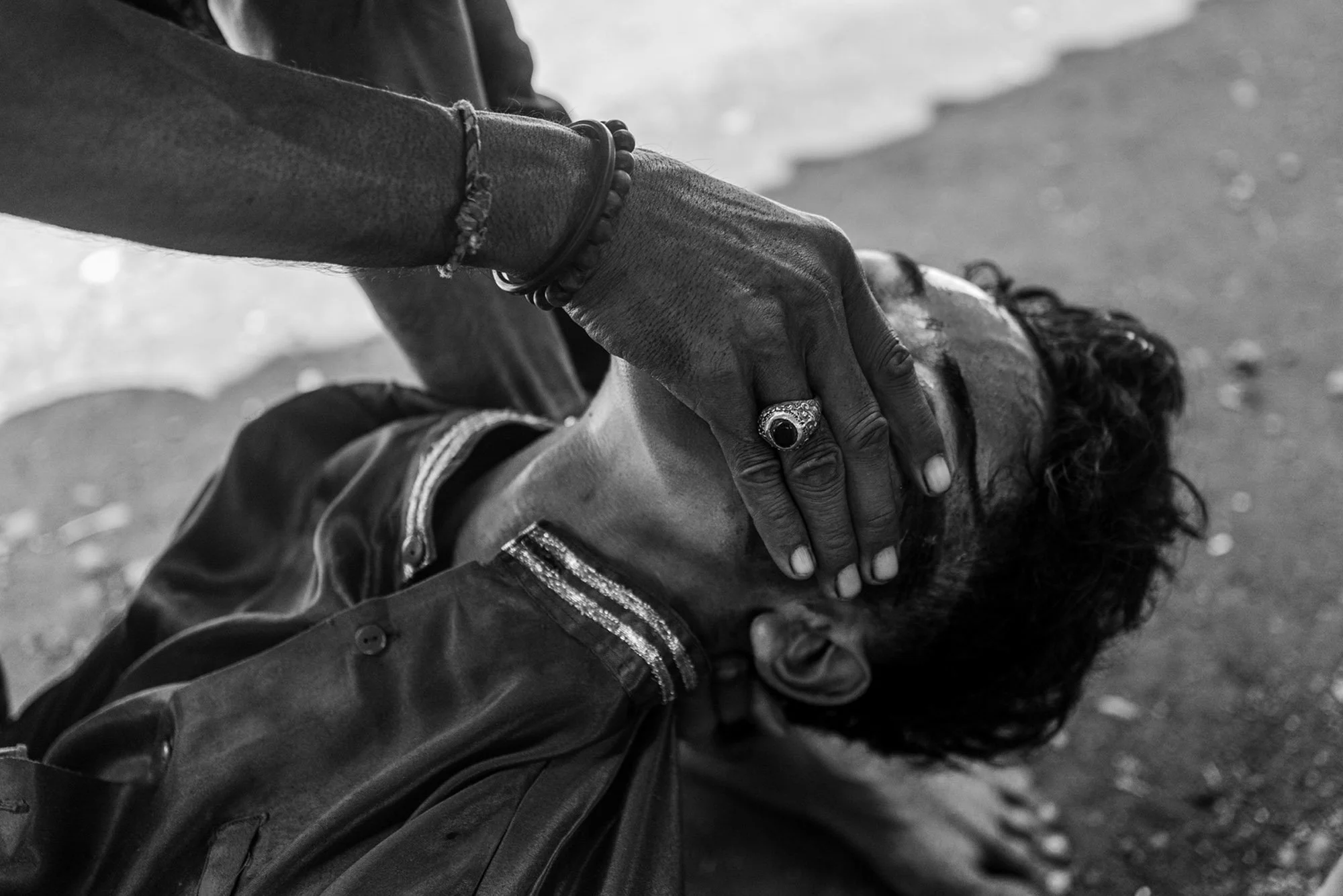 Jaranan performer getting assistance from pawang in Banyuwangi, East Java