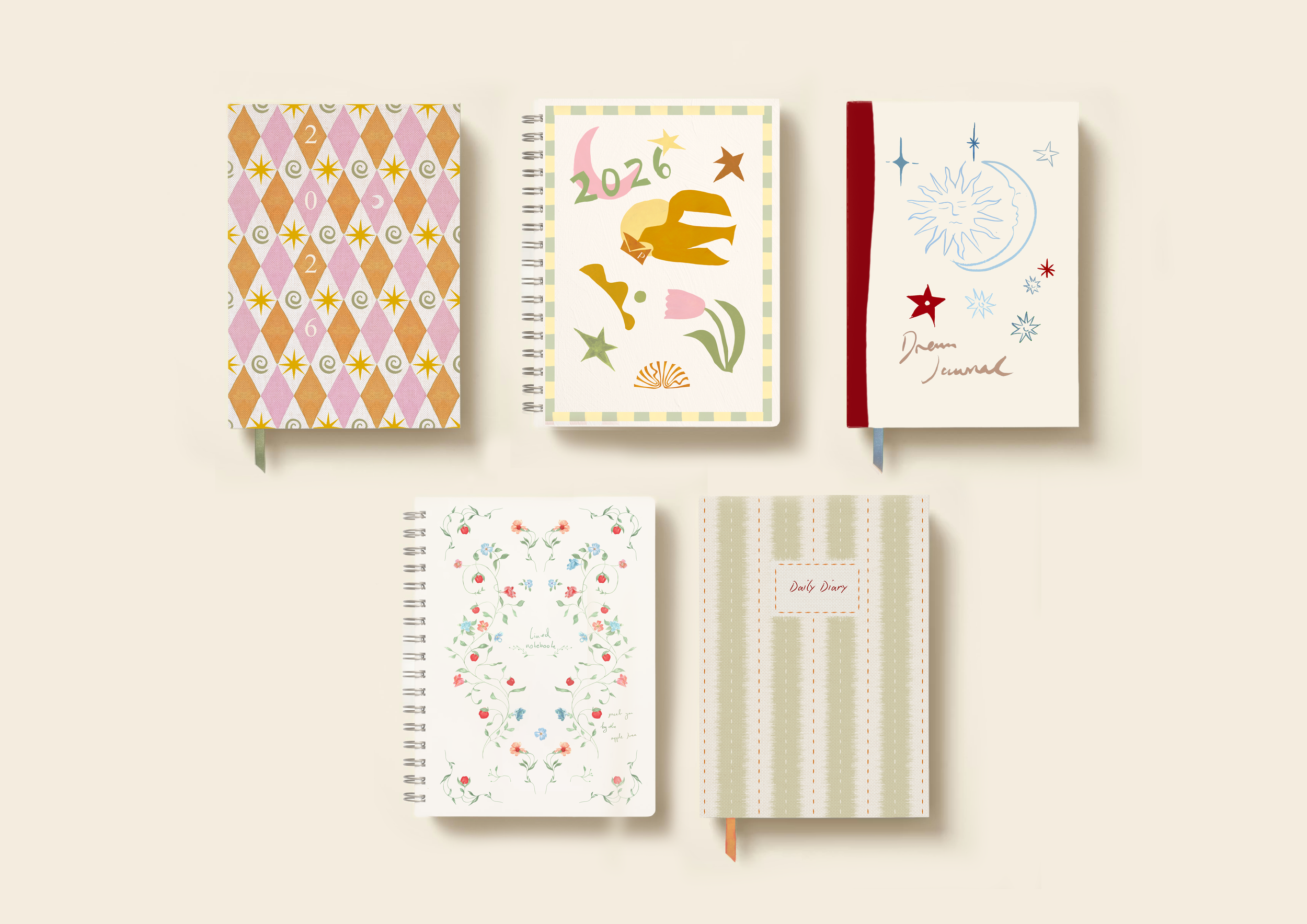 Five notebooks with various colorful covers arranged on a light beige background.