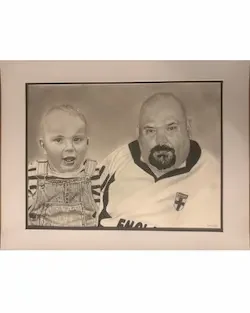 Black and white pencil portrait of a young boy and a man in an England shirt, drawn by Lou Ellen Art.