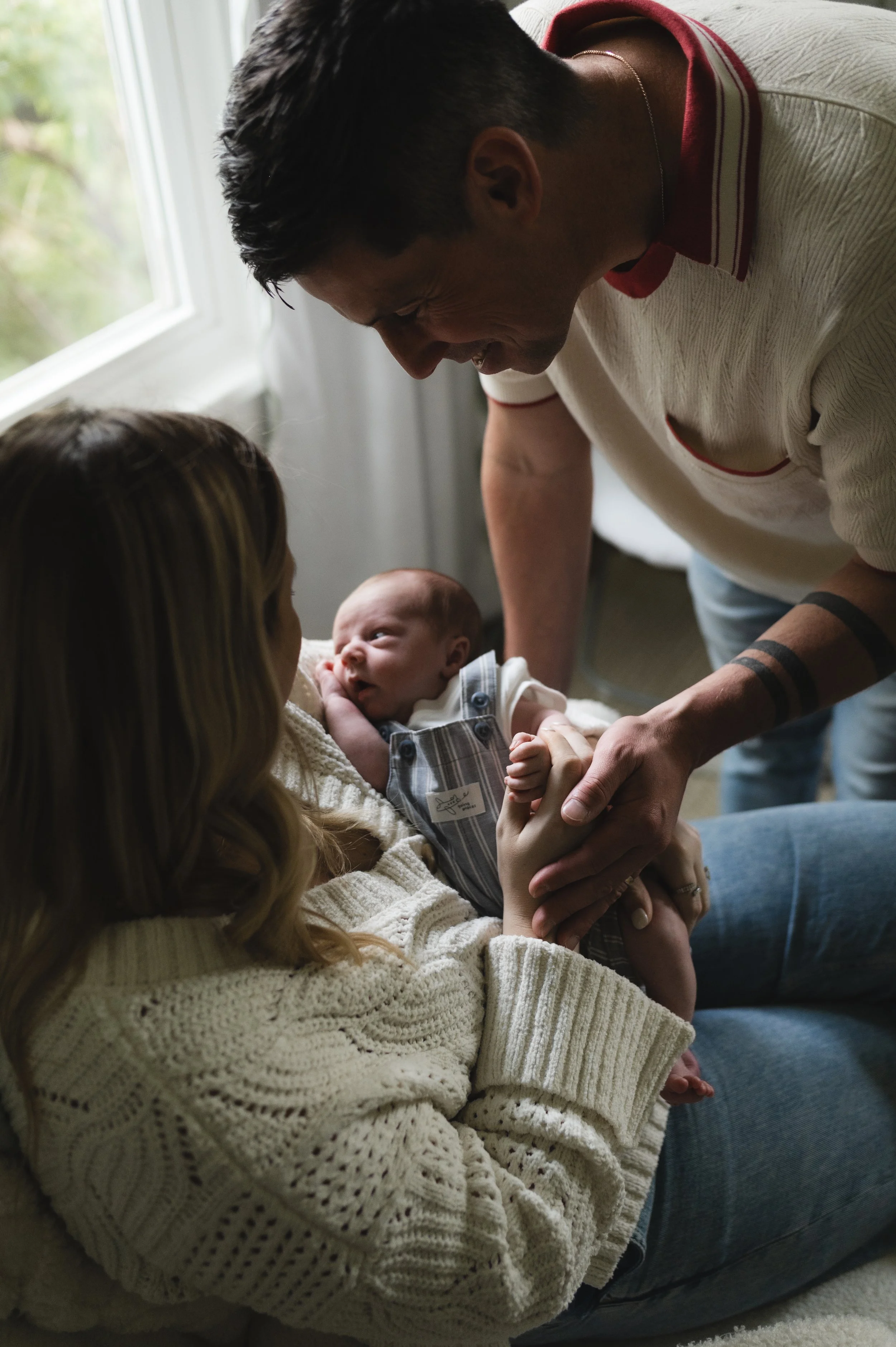 mother and father with newborn in nursery, moody, clarksville tennessee, nashville tennessee, photographer, newborn photographer, affordable