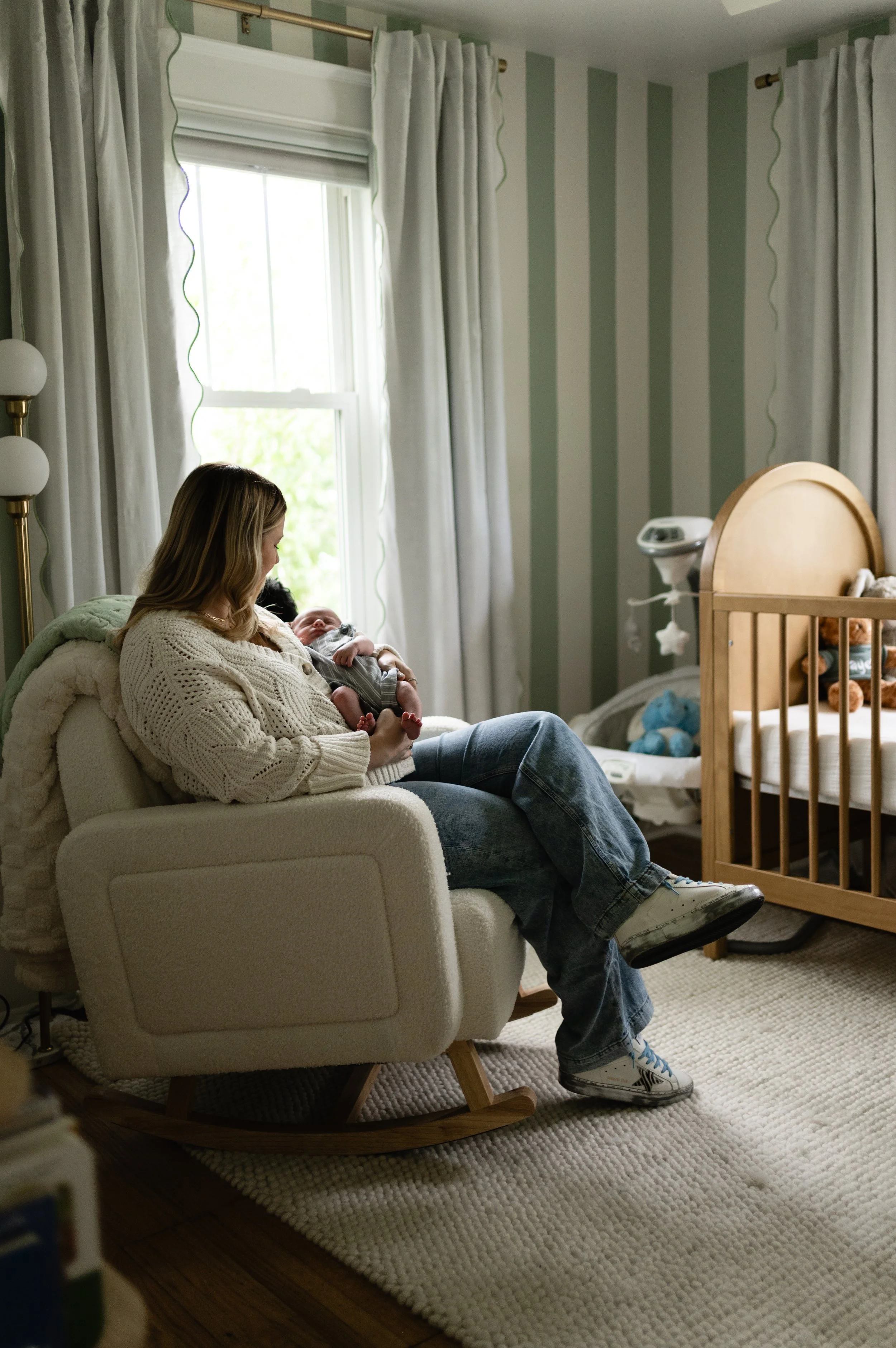 woman rocking newborn baby in nursery, in-home session, newborn photography, newborn photographer, clarksville tn, nashville tn