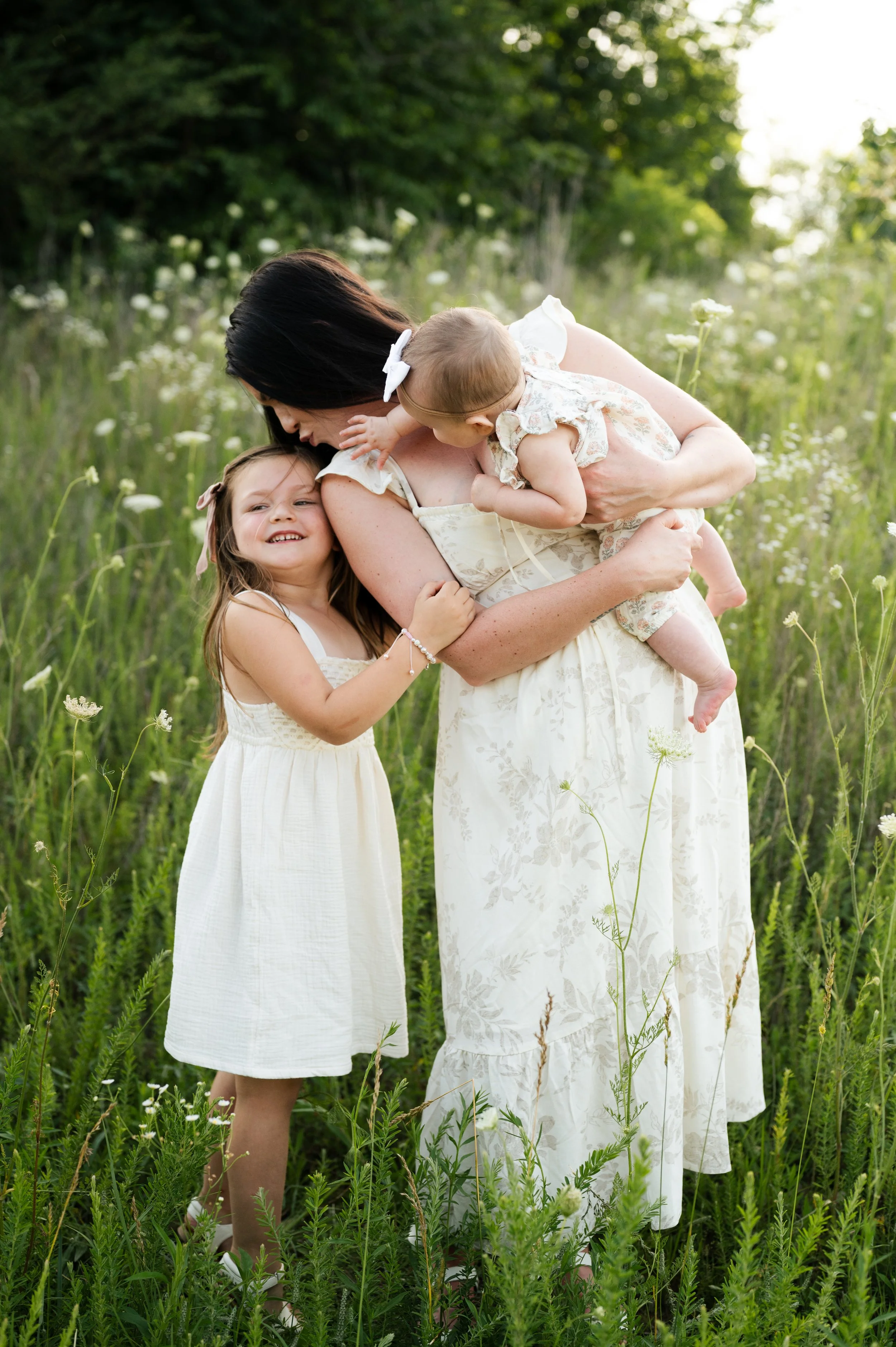 mother with baby and child in flower field, clarksville tennessee, motherhood, affordable, photographer
