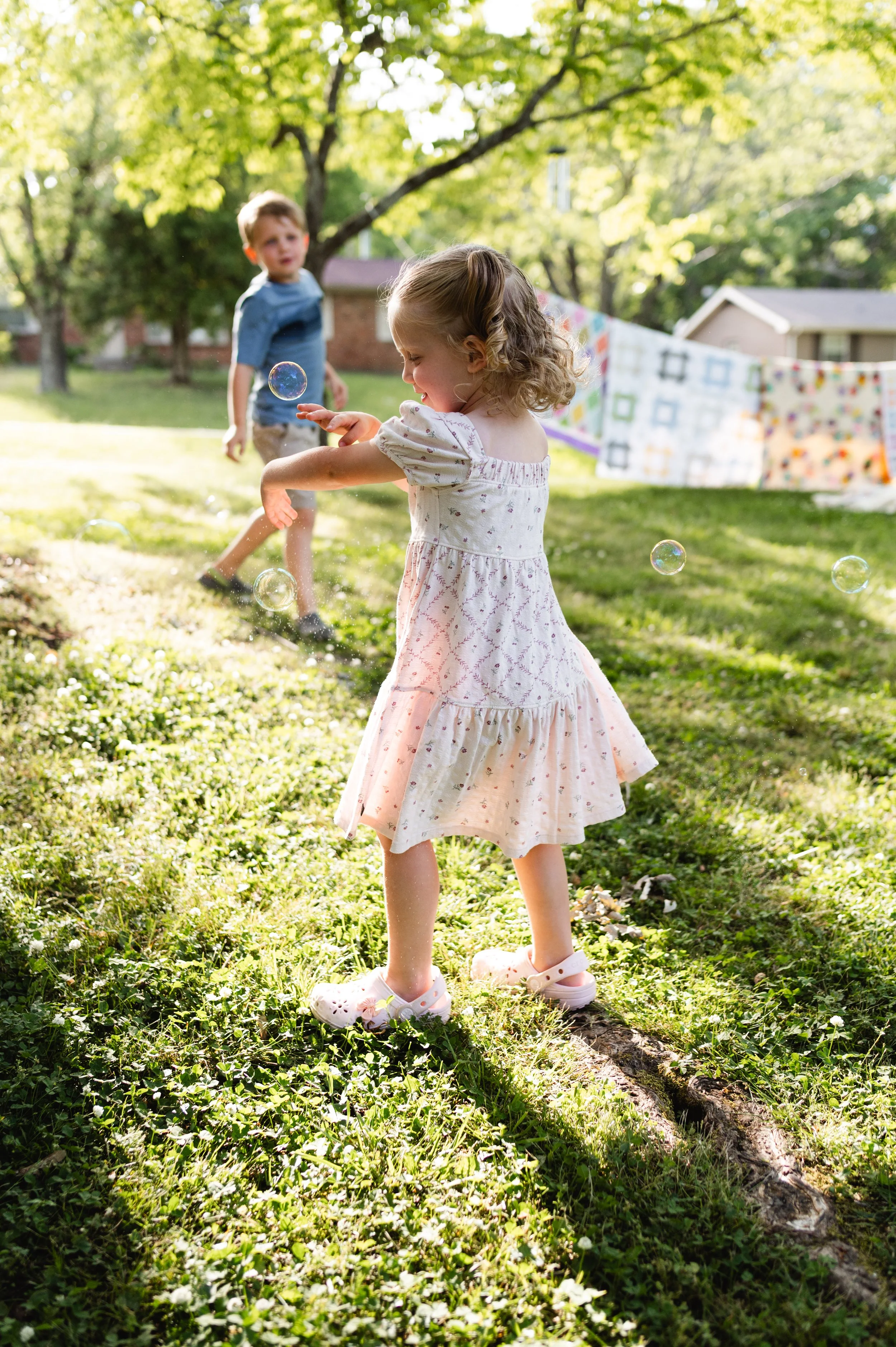 girl playing with bubbles, home sessions, candid family photos, family photographer, motherhood photographer, clarksville, nashville