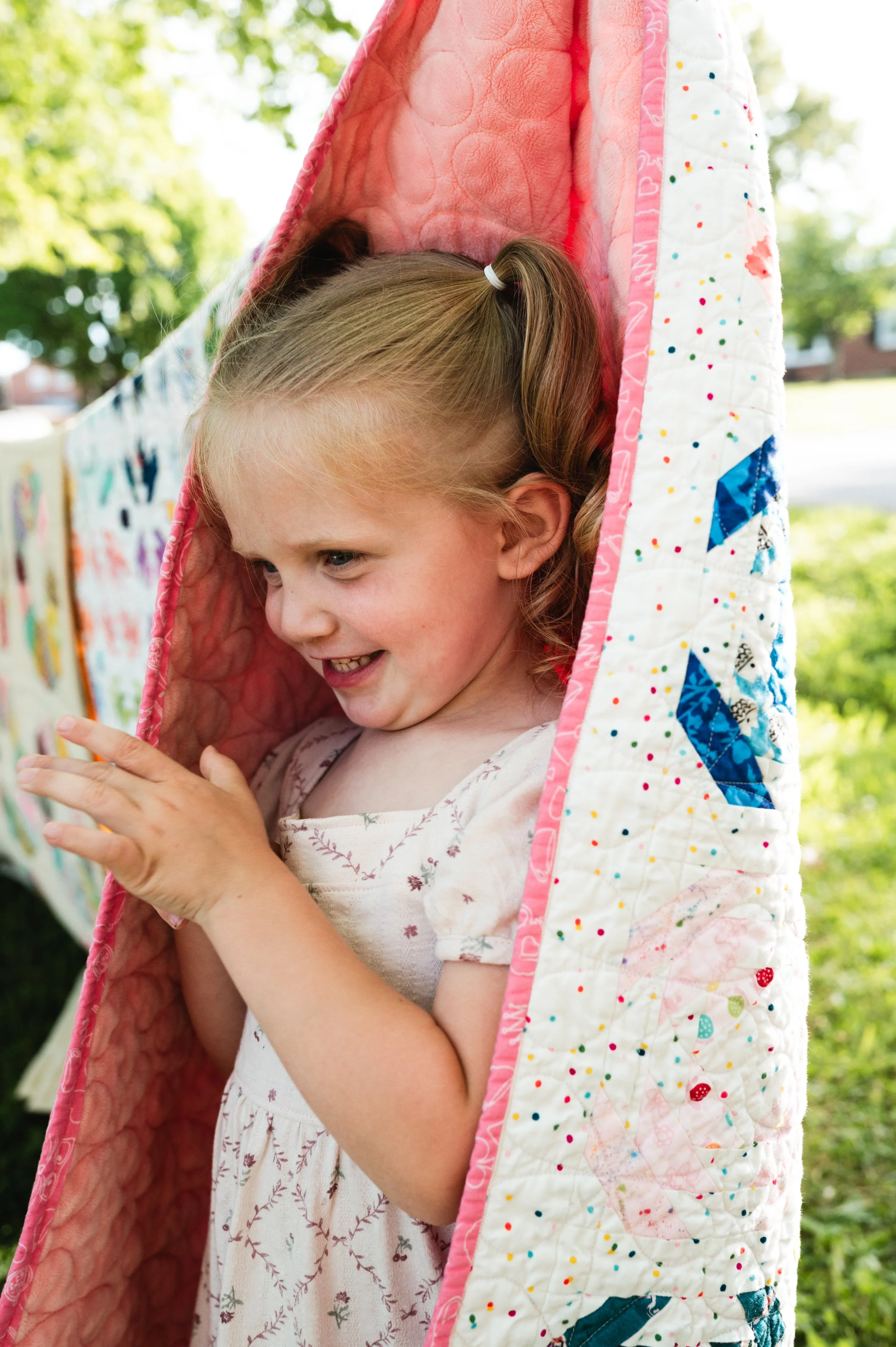 girl and quilt outside, family photographer clarksville tn, family photographer nashville tn, affordable