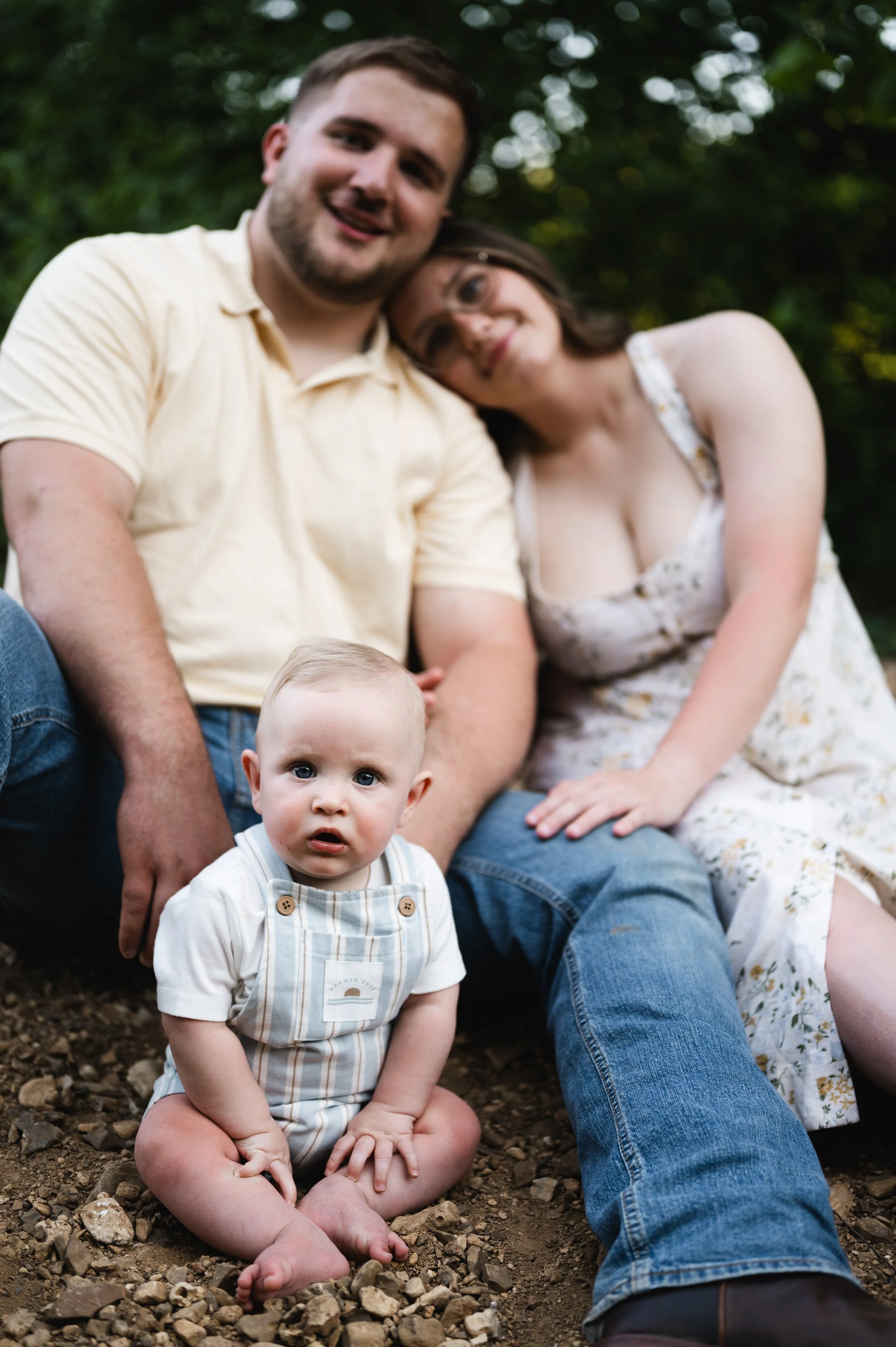 young family sit on rocky beach, clarksville tennessee, nashville, family photography, photographer