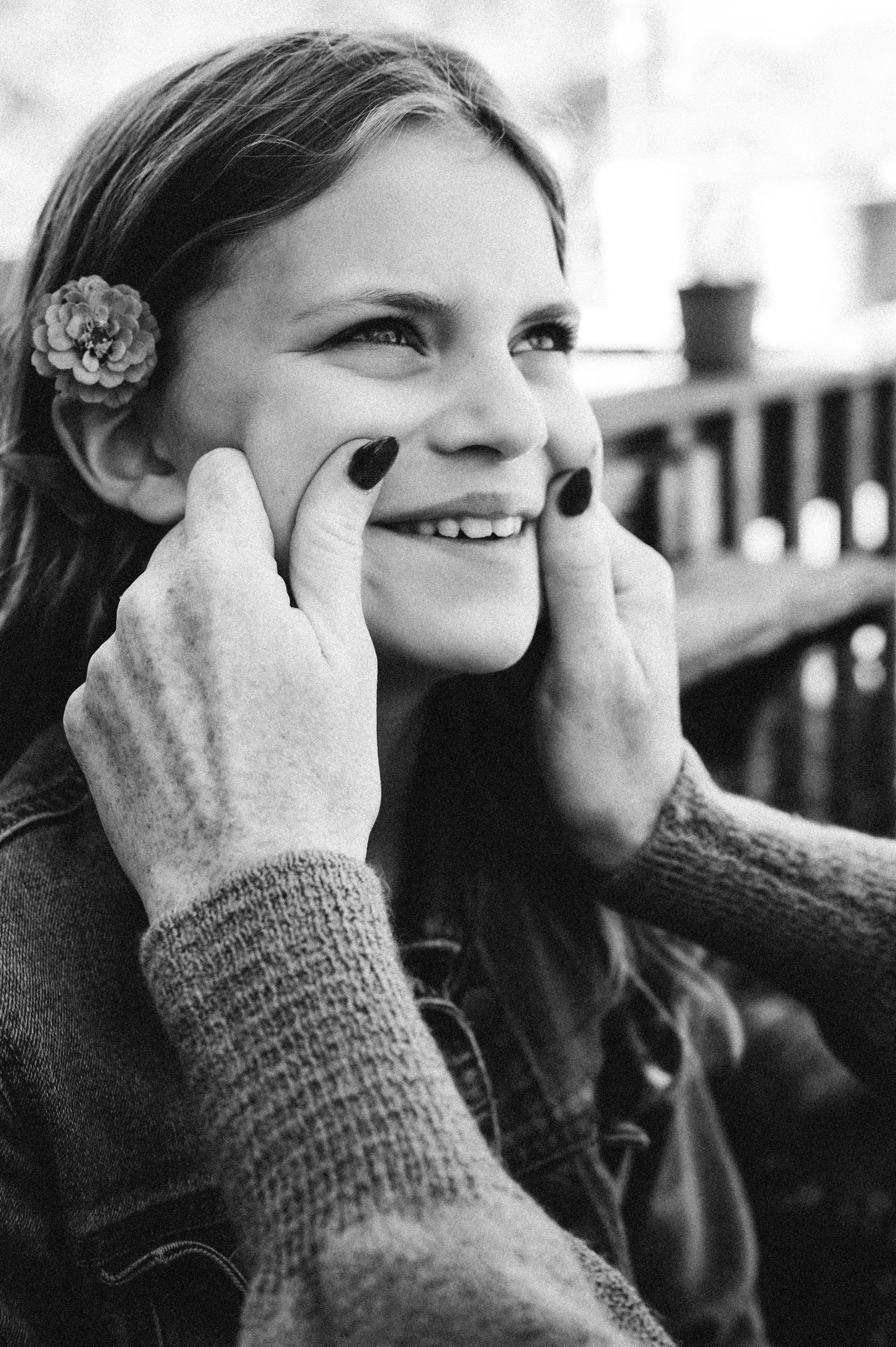 black and white photo of mother pinching young daughter's cheeks, clarksville tn, nashville tn, photographer, affordable, film, family photographer