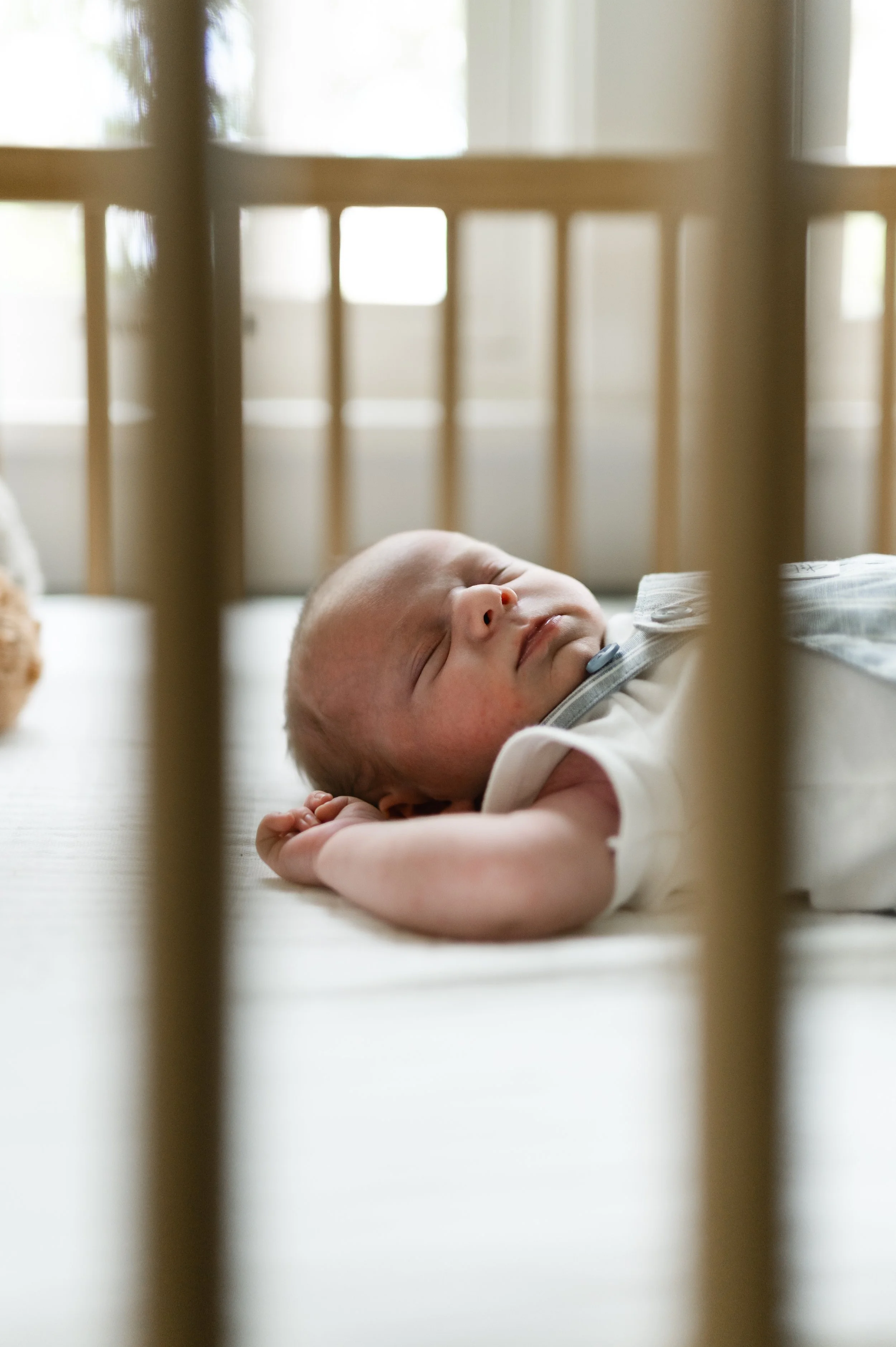 sleeping newborn in crib, at home, nursery, newborn photographer, affordable, clarksville tennessee, nashville tennessee, madison tennessee