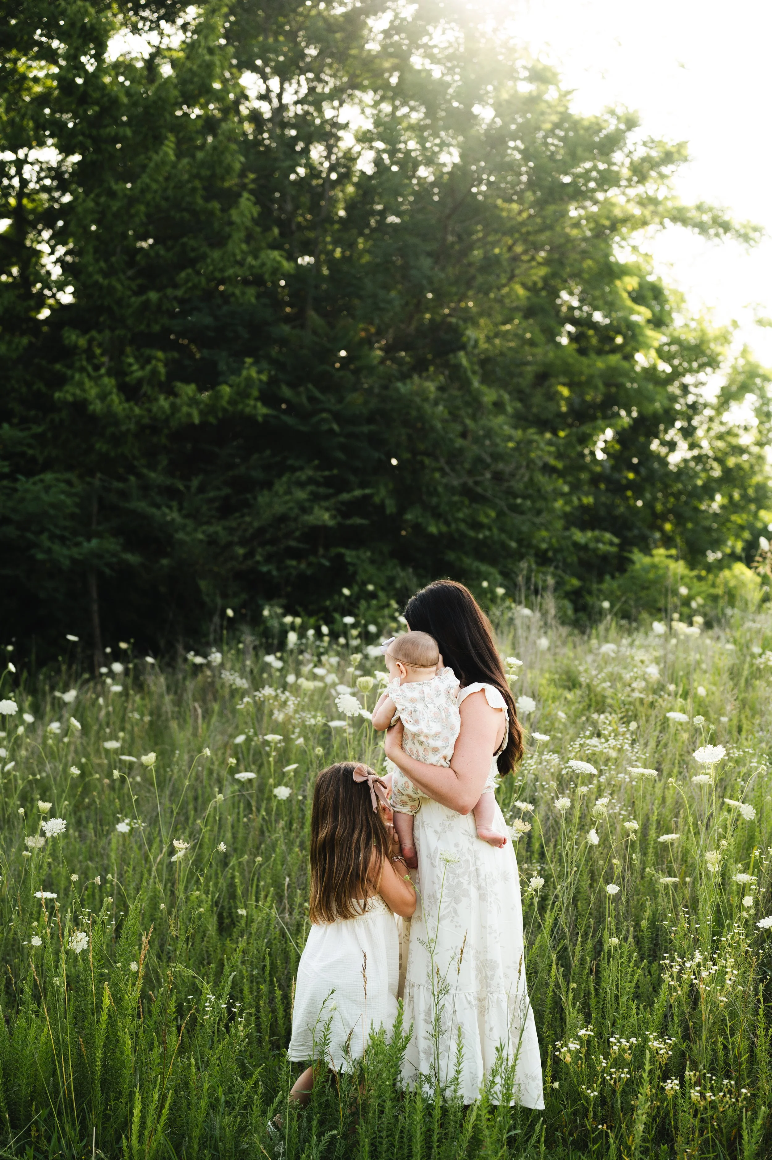 mother with children in flower field at golden hour, clarksville tennessee, photographer, affordable