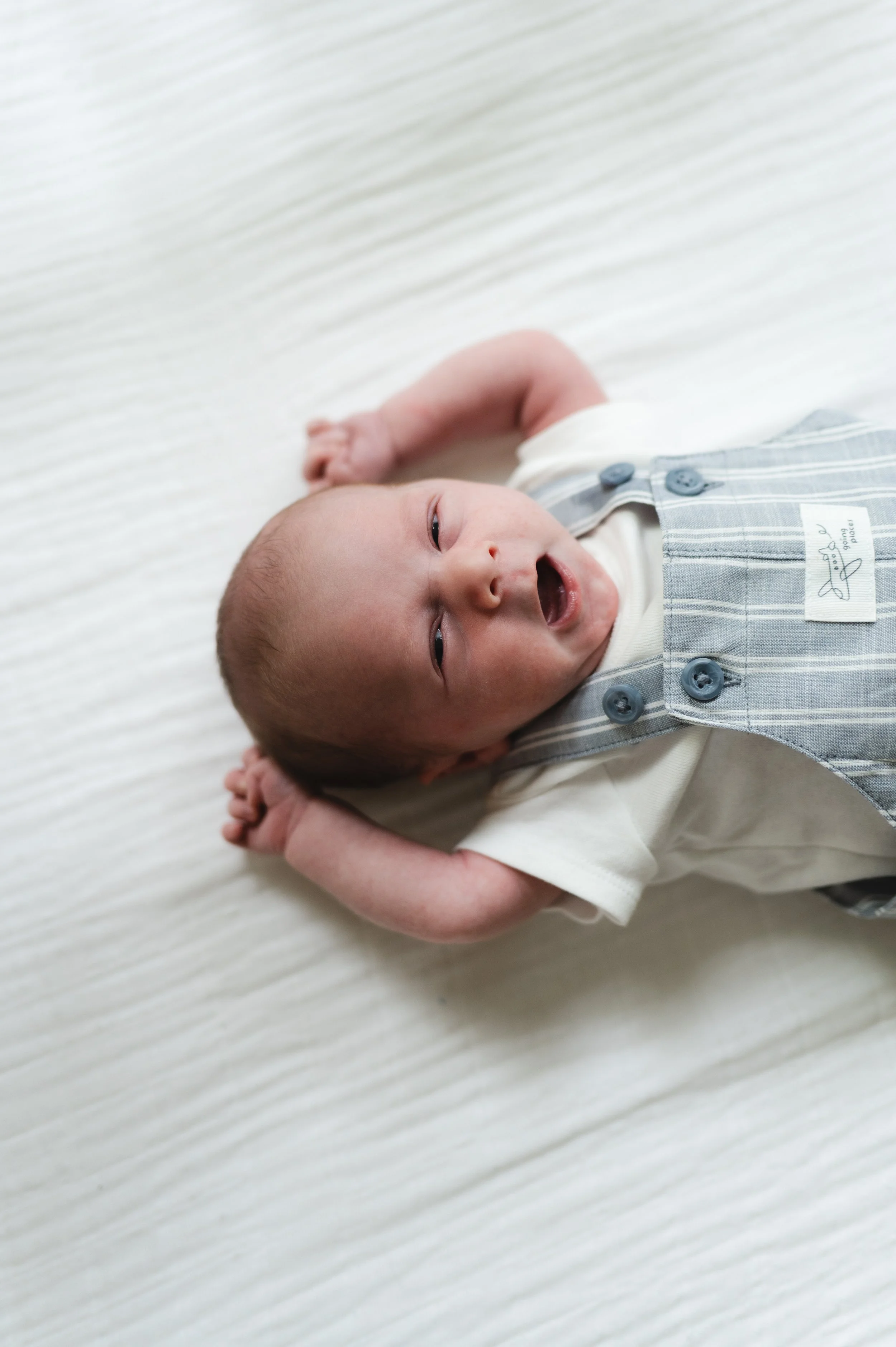 yawning newborn in crib, nursery, newborn photos, newborn photographer, photographer, affordable, clarksville tennessee, nashville tennessee