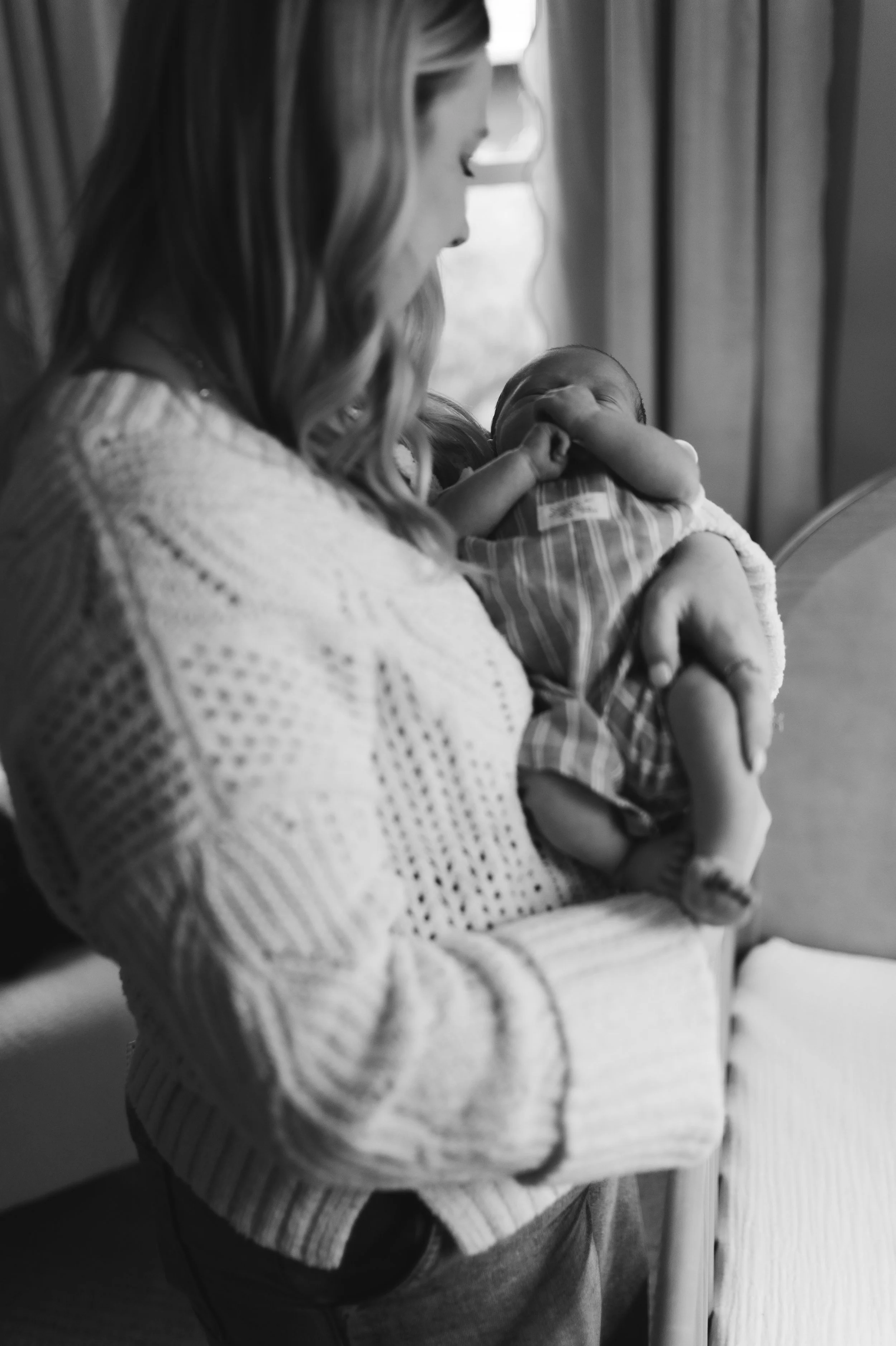 black and white, mother holding newborn, candid, nursery, newborn photography, newborn photographer, affordable, clarksville tn, nashville tn