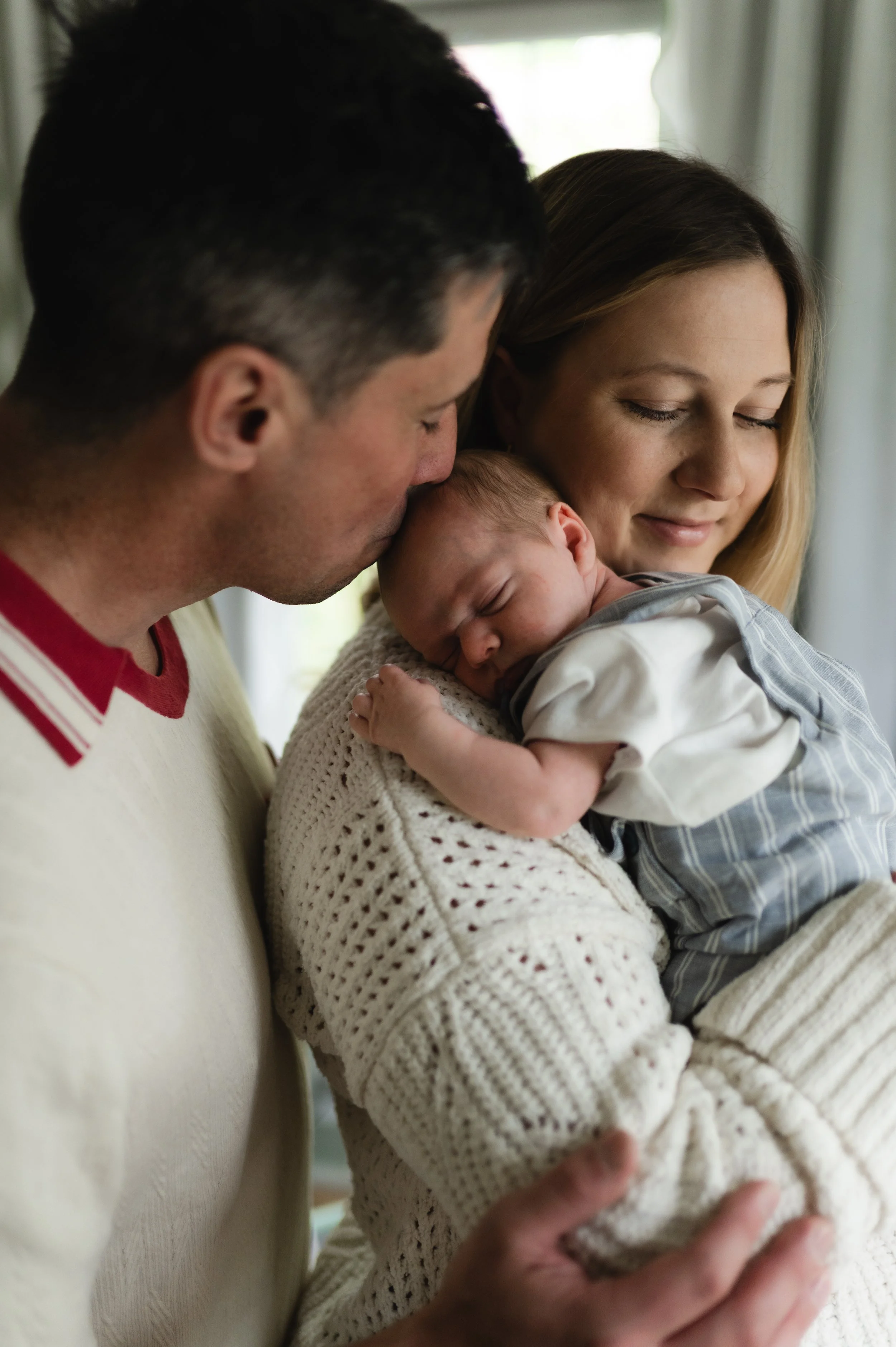 man and woman with sleeping newborn, clarksville tennessee, nashville tennessee, newborn photographer, affordable, nursery, at home, newborn photos, newborn session, newborn photography