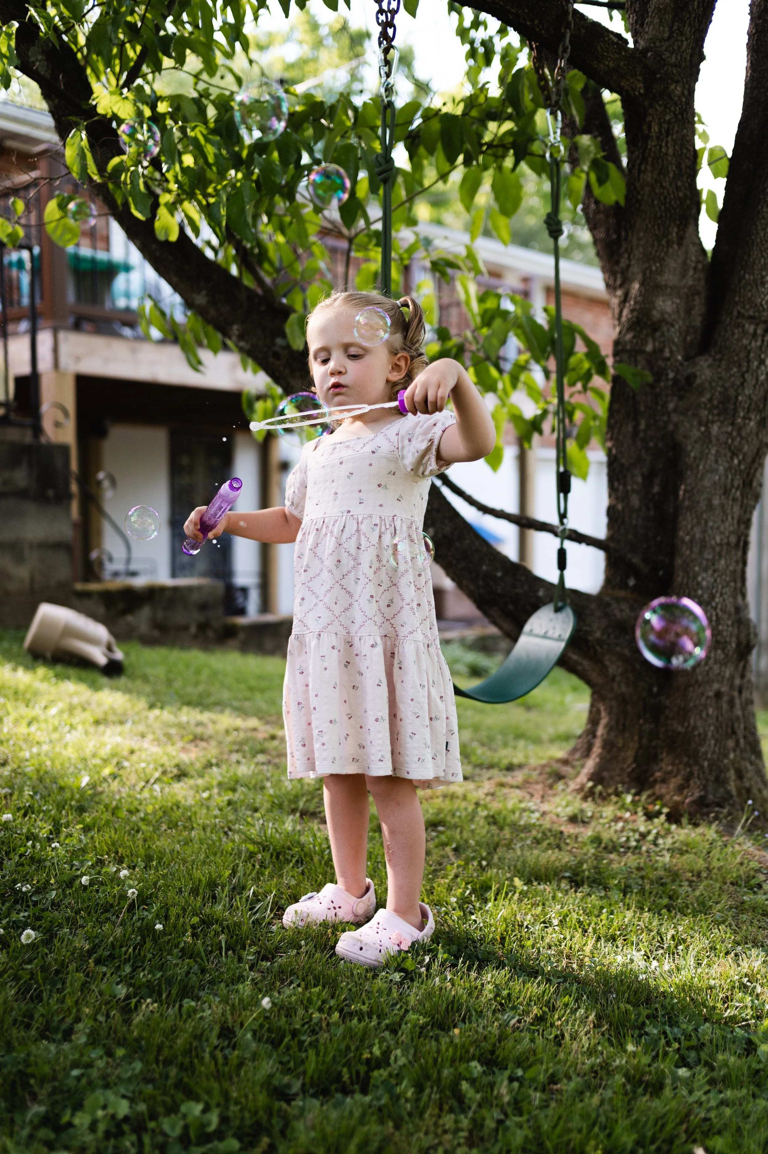 girl blowing bubbles, candid family photos, motherhood session, family photographer, clarksville tn, affordable, nashville tn