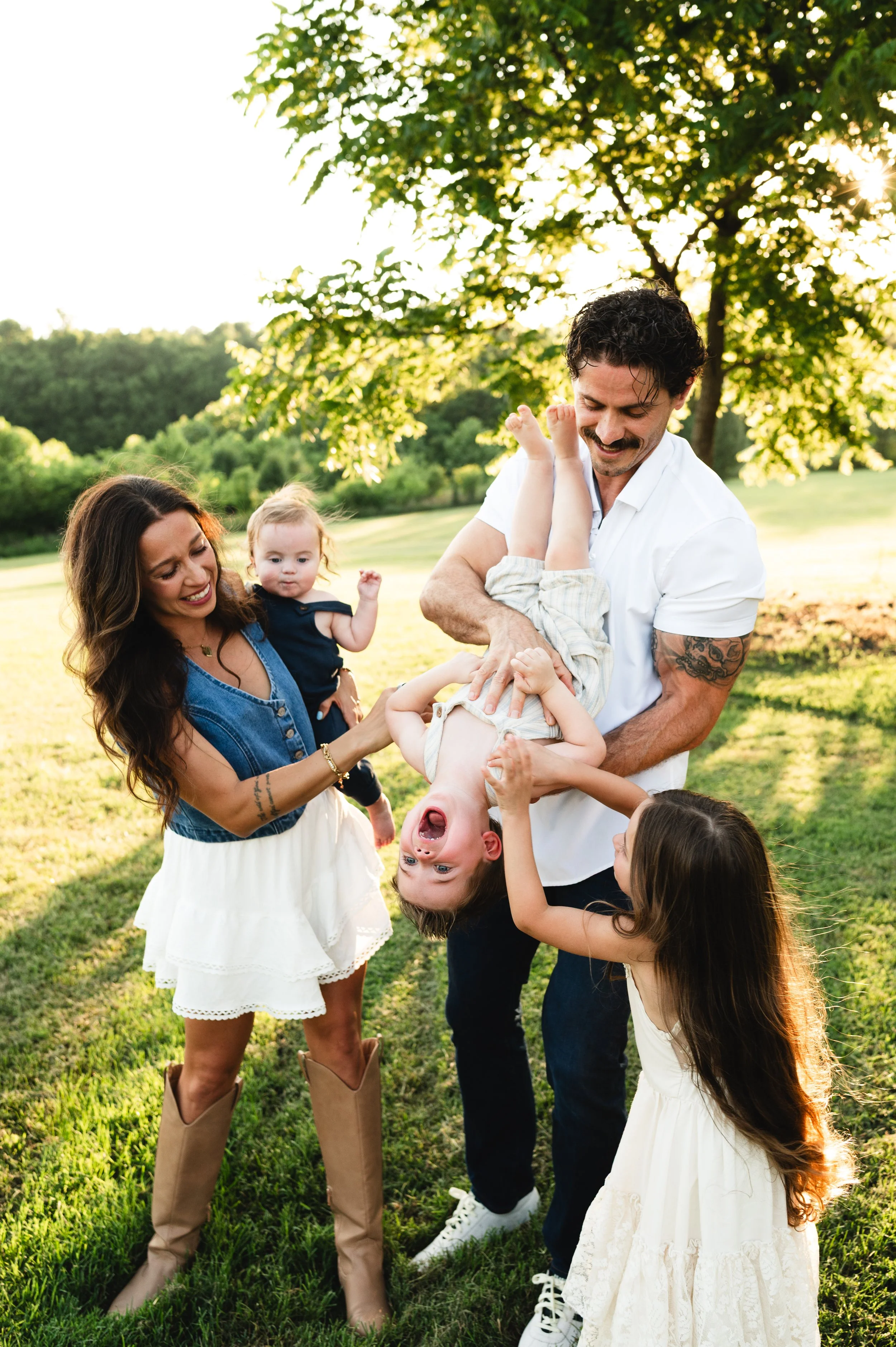 playful family in open field, family photographer, affordable, clarksville and nashville tennessee