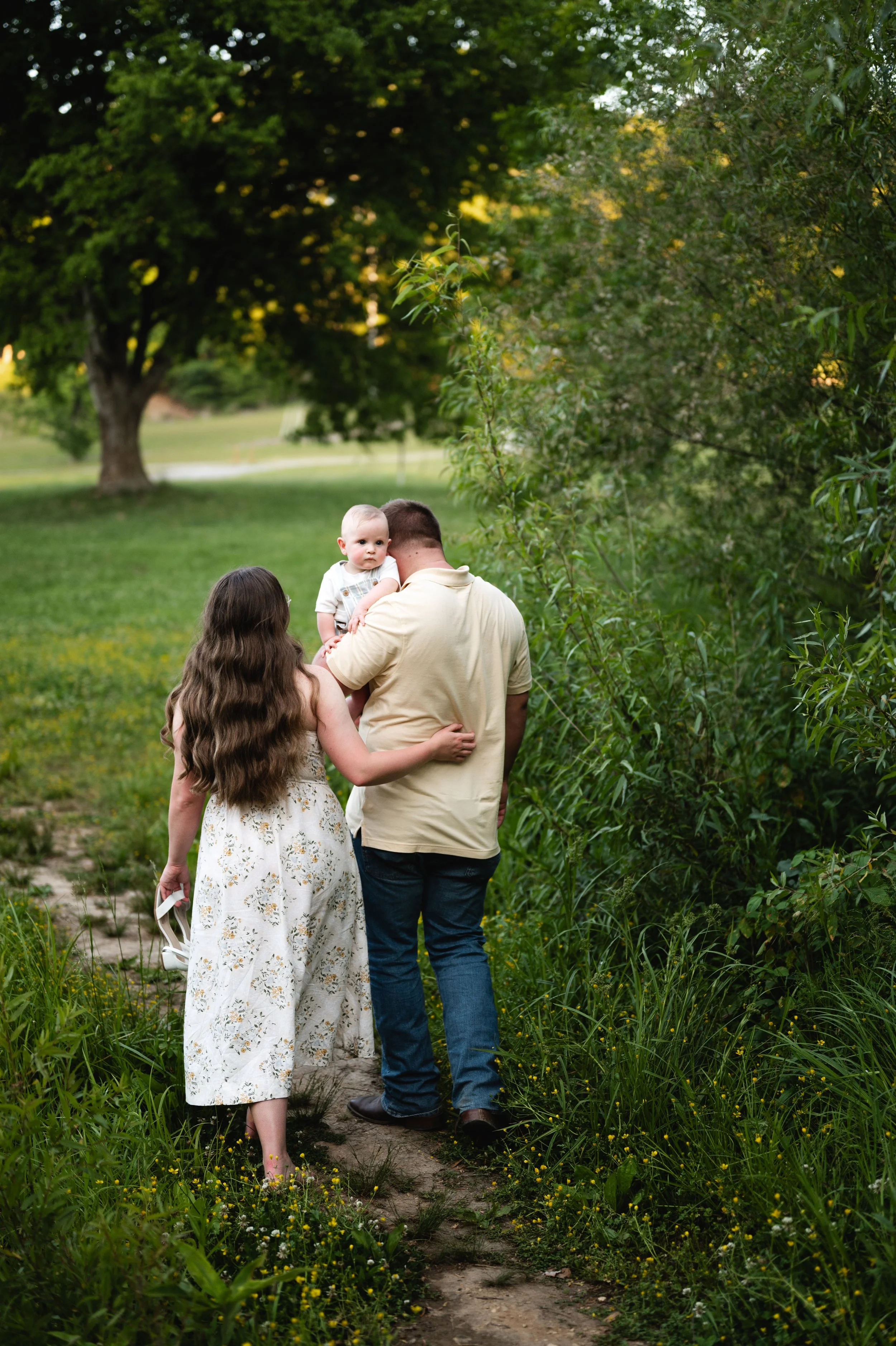 young family walking down path, nashville, clarksville tennessee, family photographer