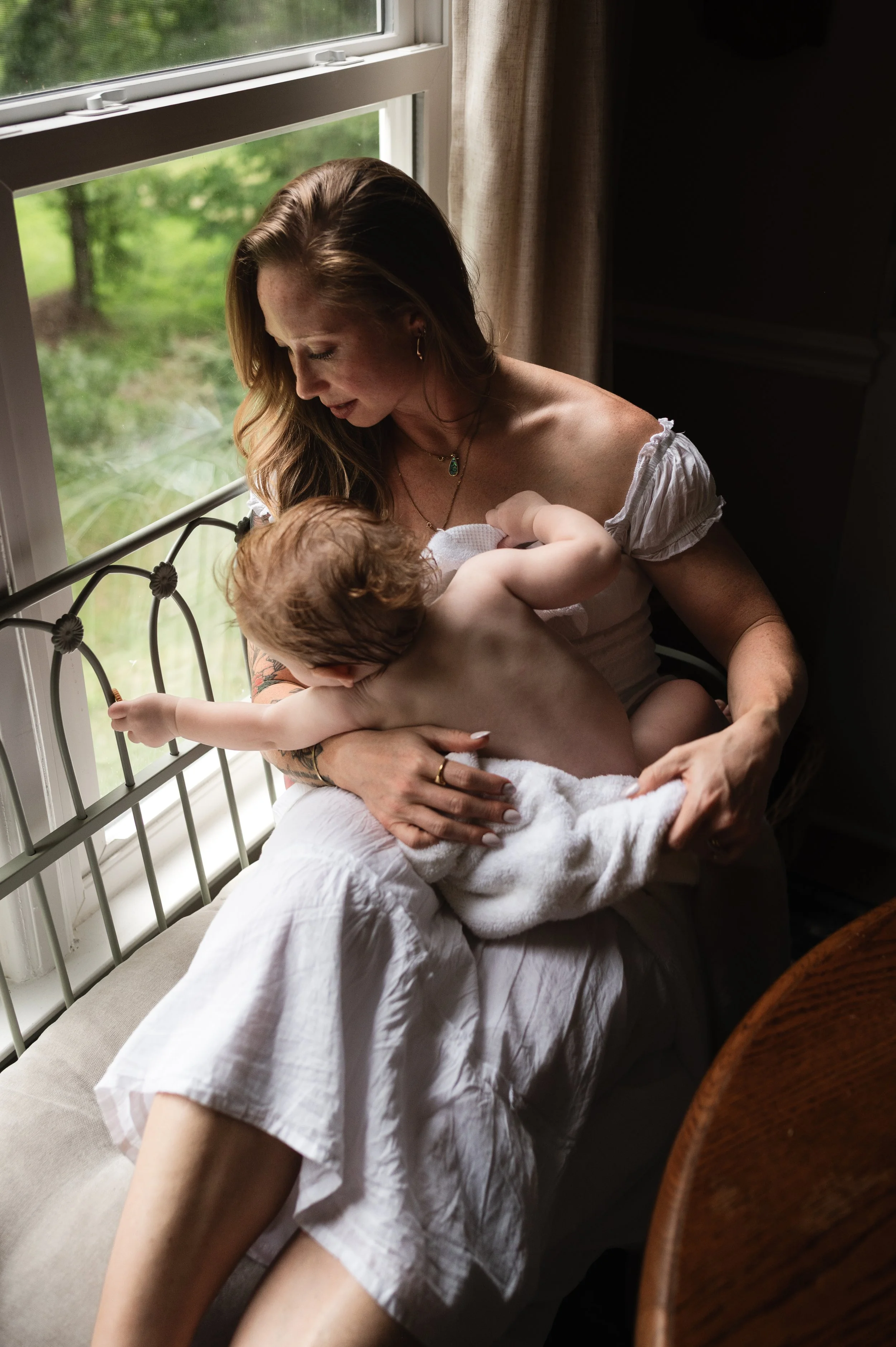 woman and child by window, moody, motherhood, milestone, photographer, clarksville tennessee