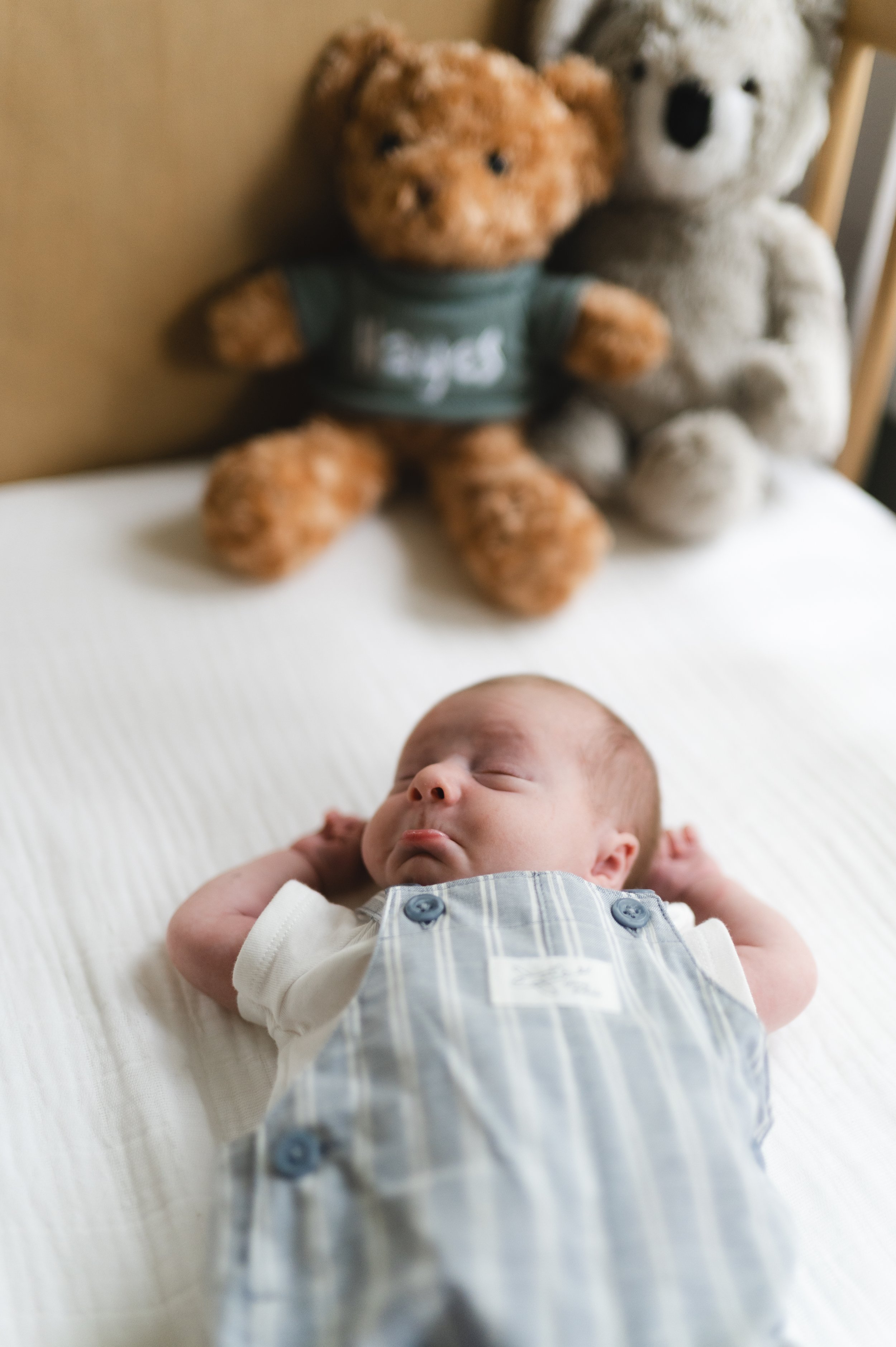 crying newborn baby in crib, clarksville tennessee, nashville tennessee, newborn photographer, affordable, neutral nursery