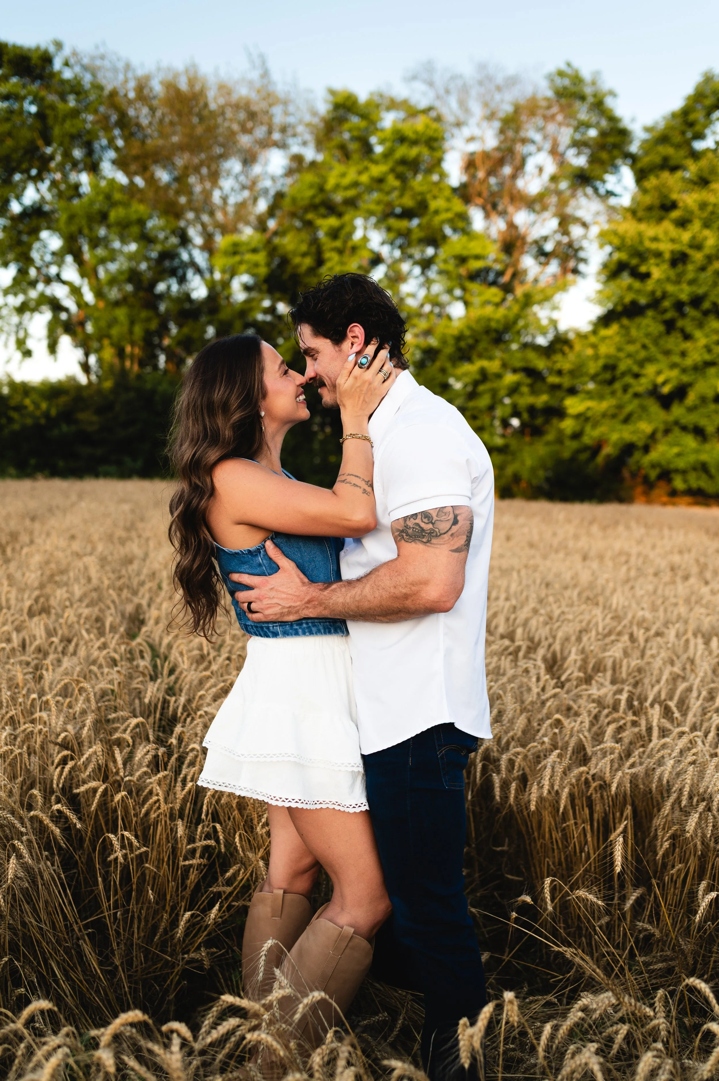 couple kissing in wheat field, engagement photos, couples photos, photographer, clarksville and nashville tennessee