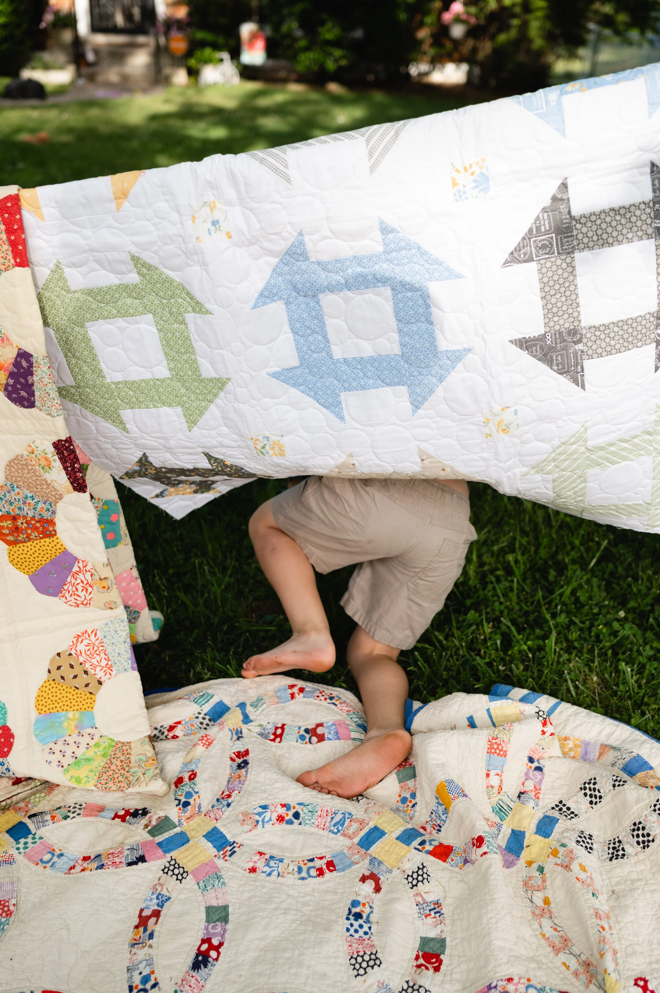 boy plays in blanket tent, affordable, candid family photos, family photographer, nashville tn, clarksville tennessee