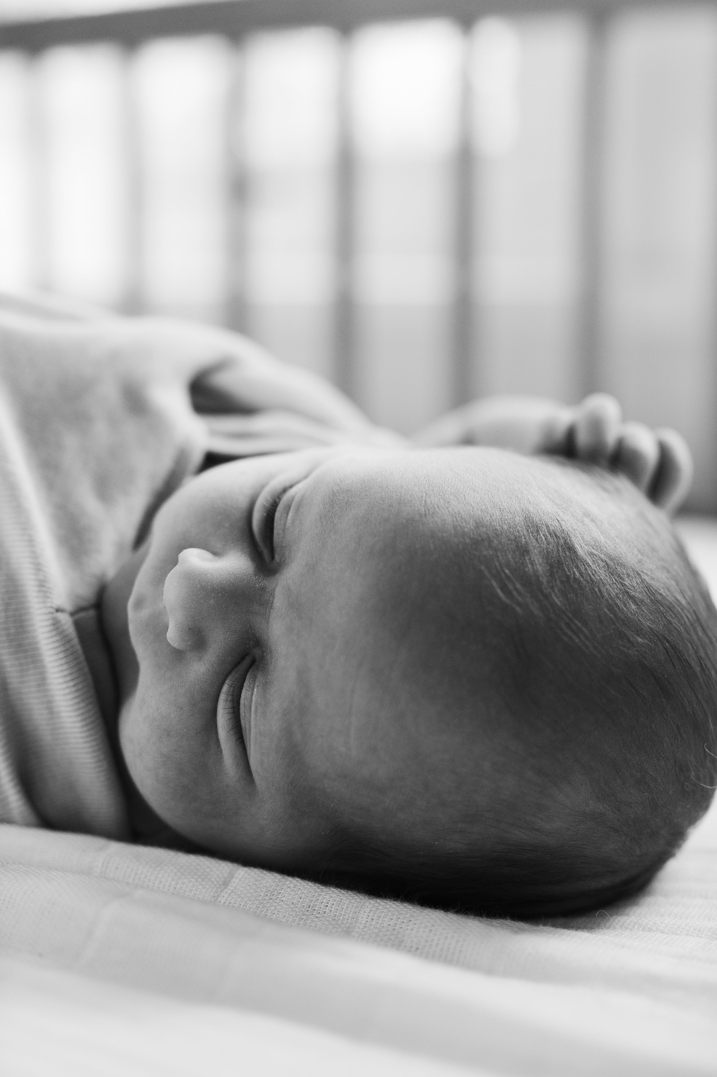 black and white, sleeping baby in crib, newborn photos, newborn photographer, clarksville tennessee, nashville tennessee, affordable