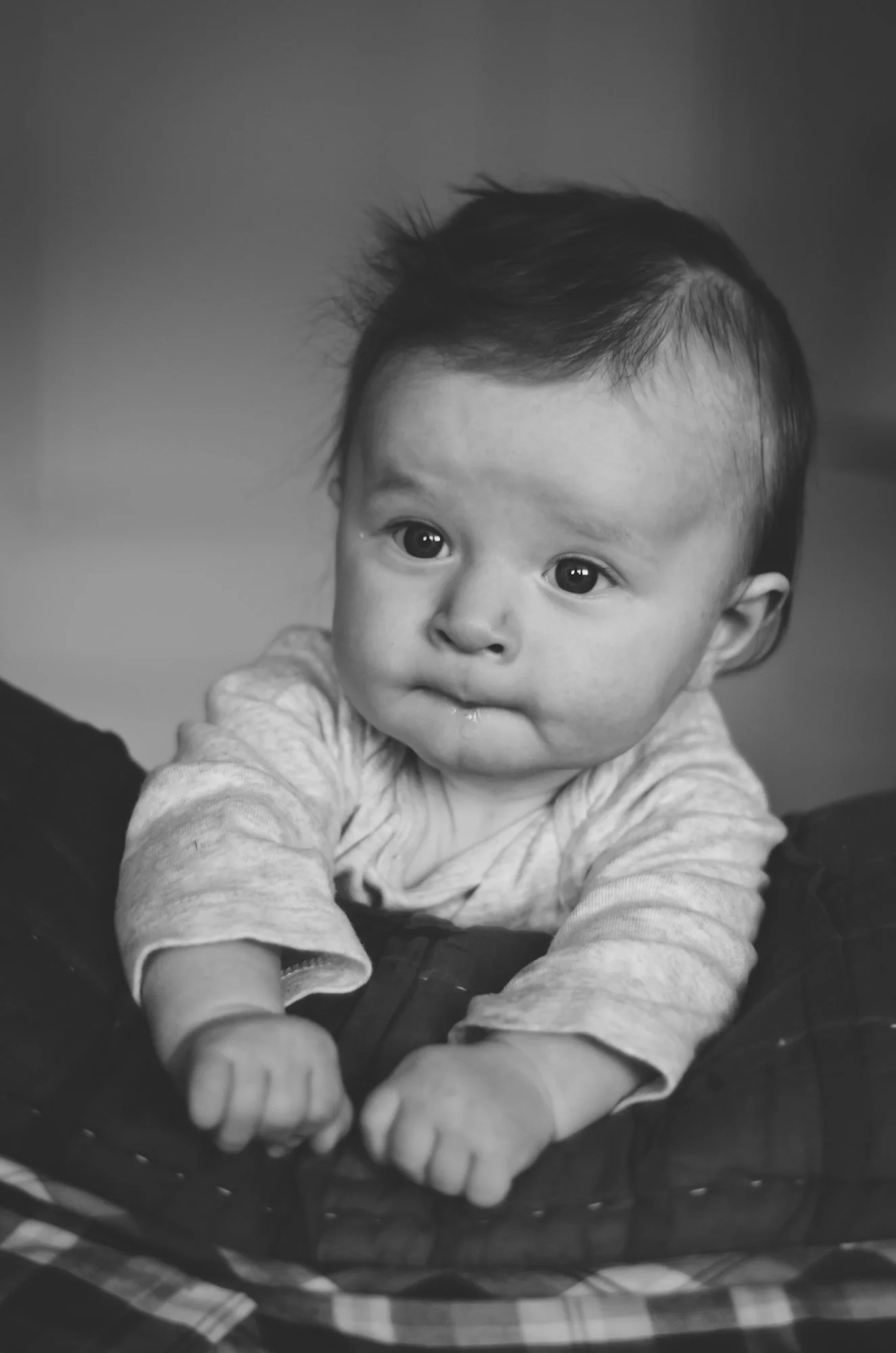 four month old baby lays on pillow in bed, clarksville tn, nashville tn, photographer, newborn, child, milestone, birthday, film photographer, family photographer, affordable